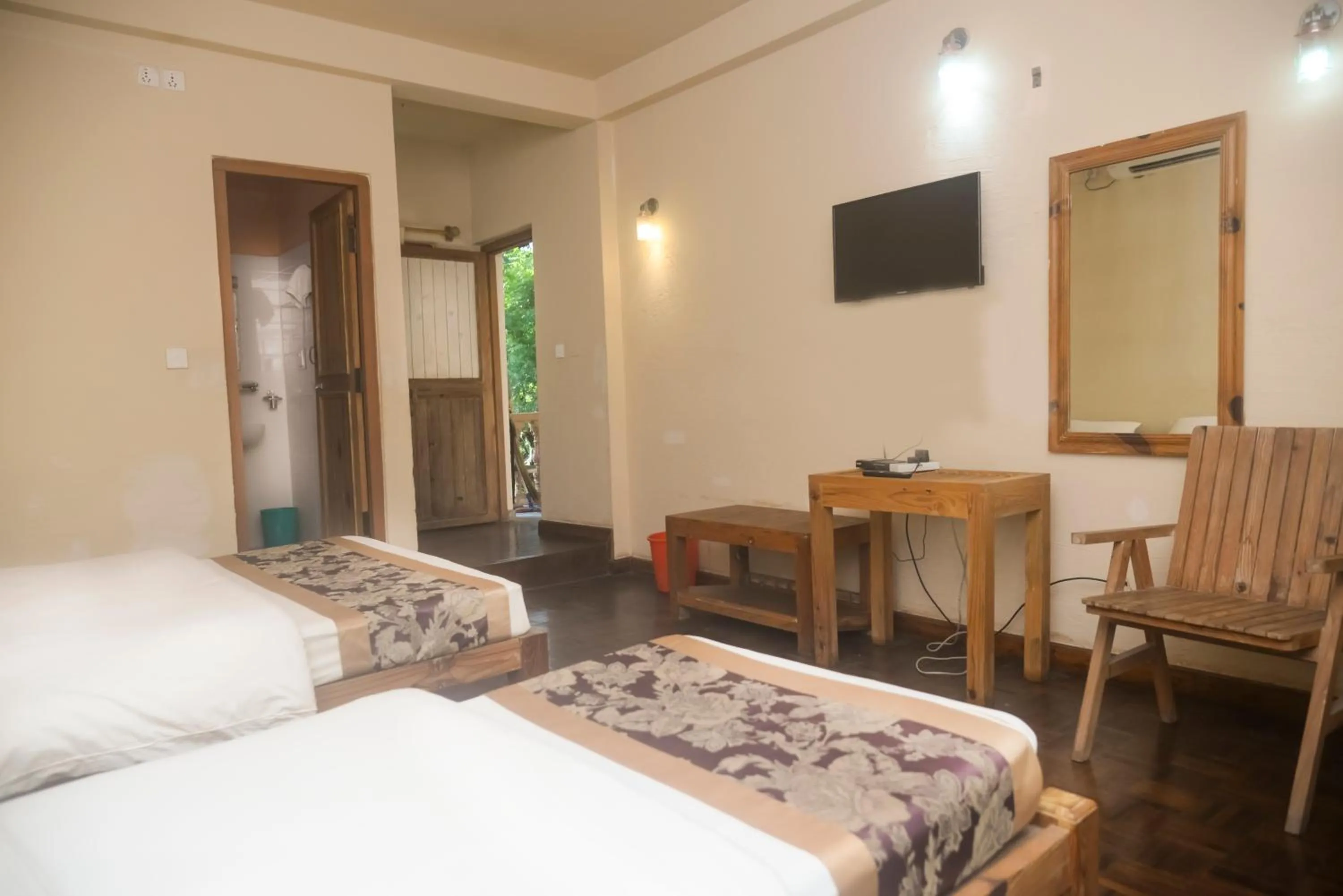 TV and multimedia, Bed in Chitwan Paradise Hotel