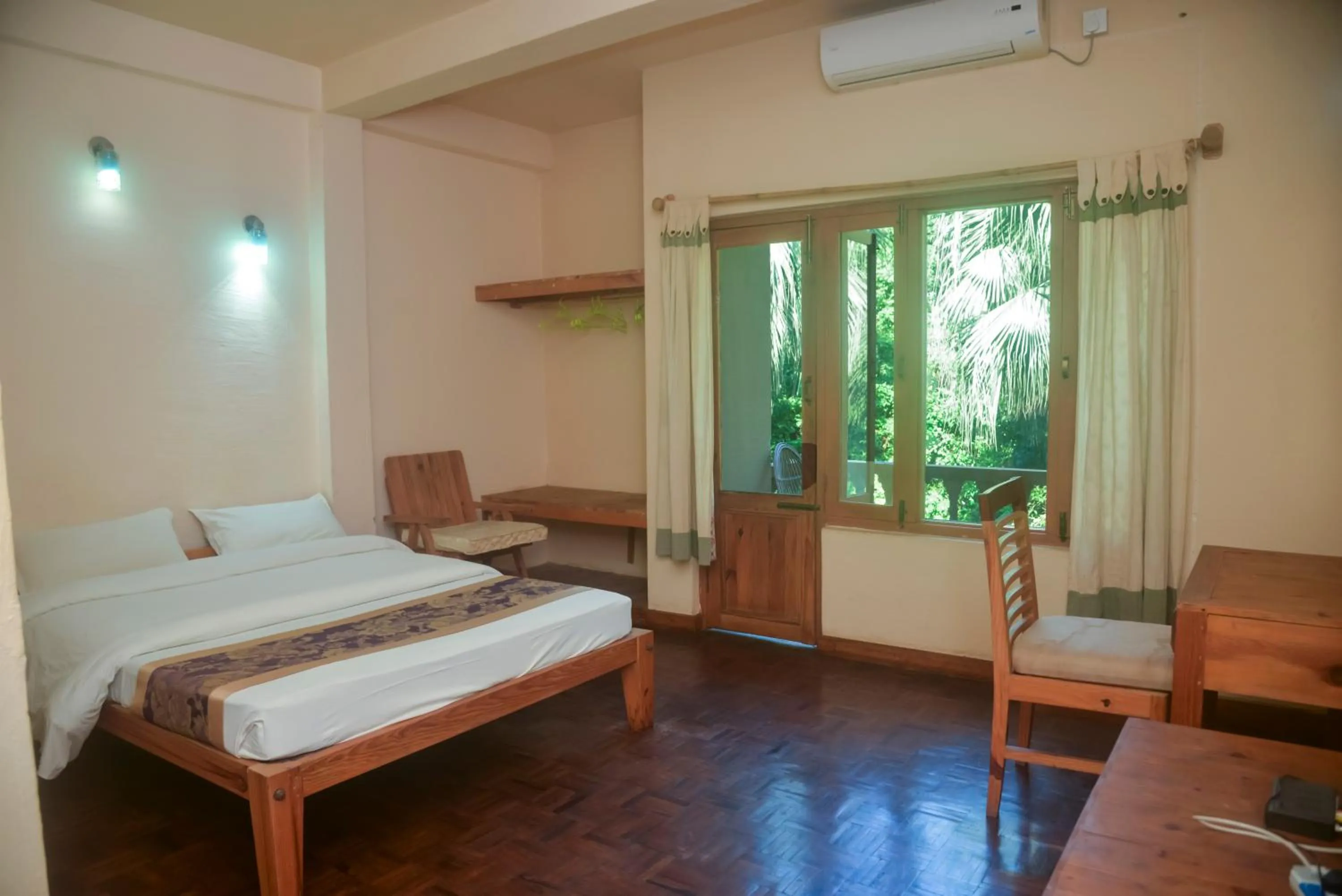 Bed in Chitwan Paradise Hotel