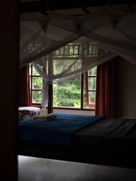 Bed in Chitwan Paradise Hotel