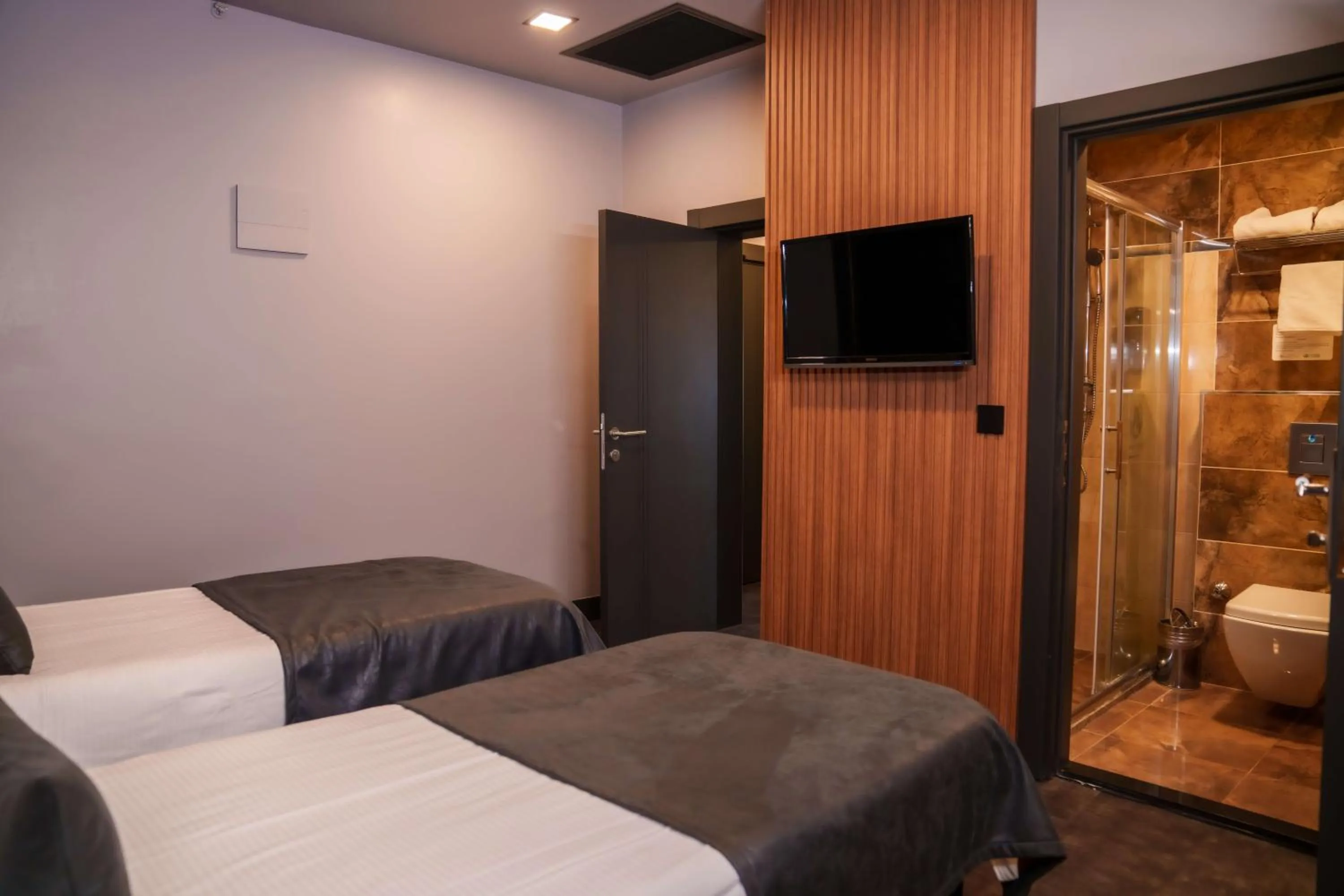 Bed in SennaCity Hotel