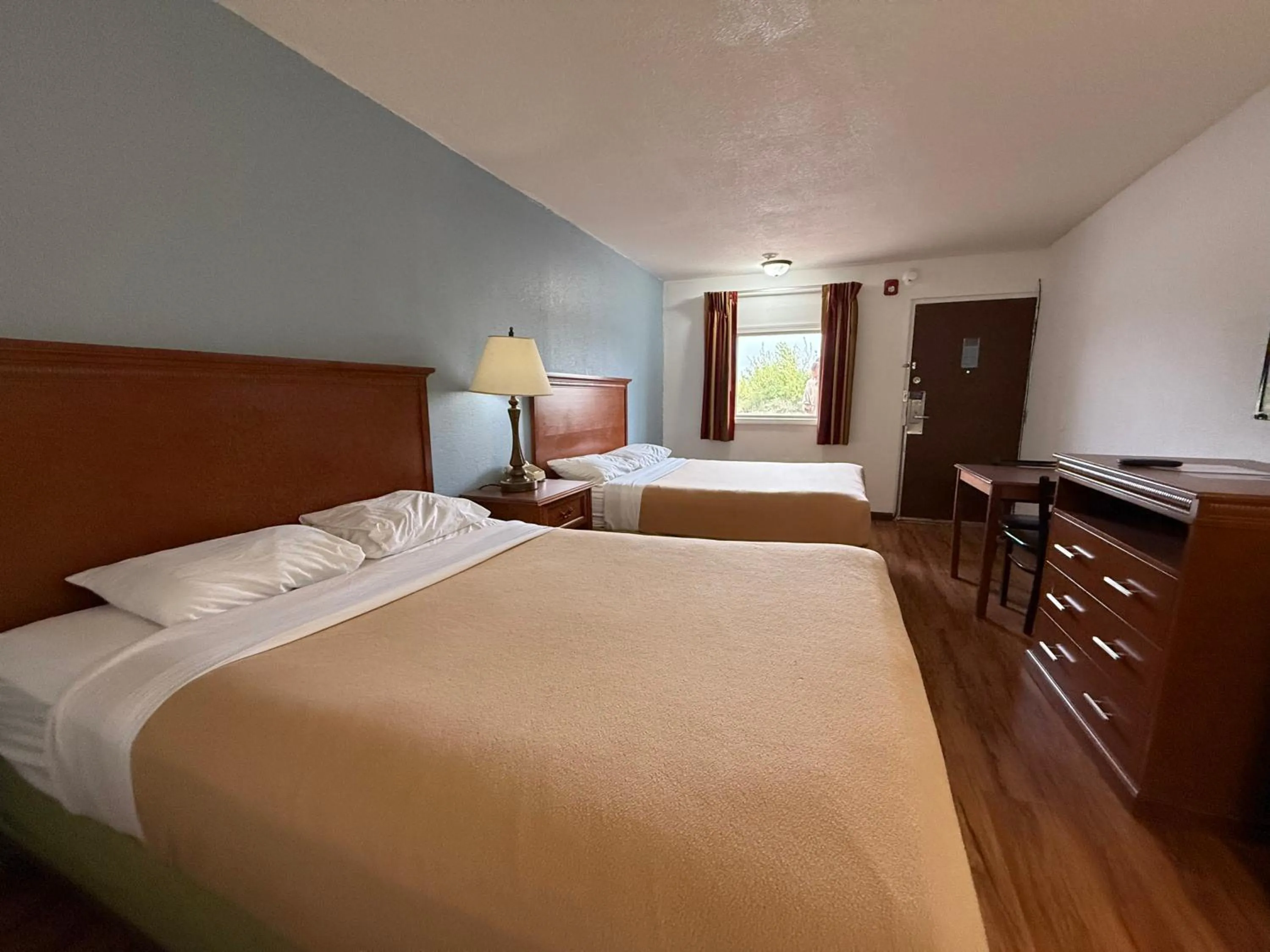 Bed in Relax Inn & Suites