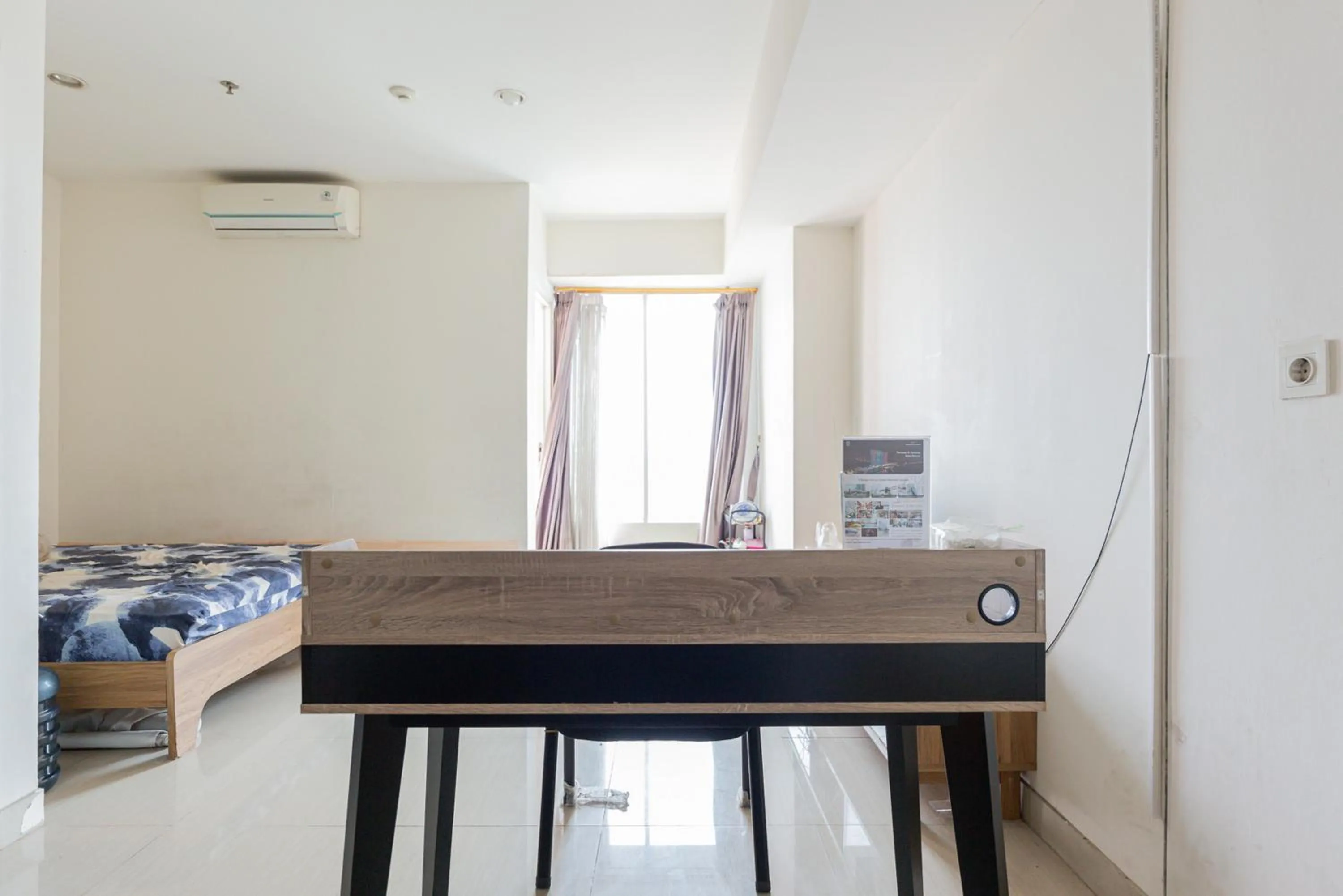 Bedroom in RedLiving Apartemen Grand Kamala Lagoon - Rooms 911 Tower Barclay South with Netflix