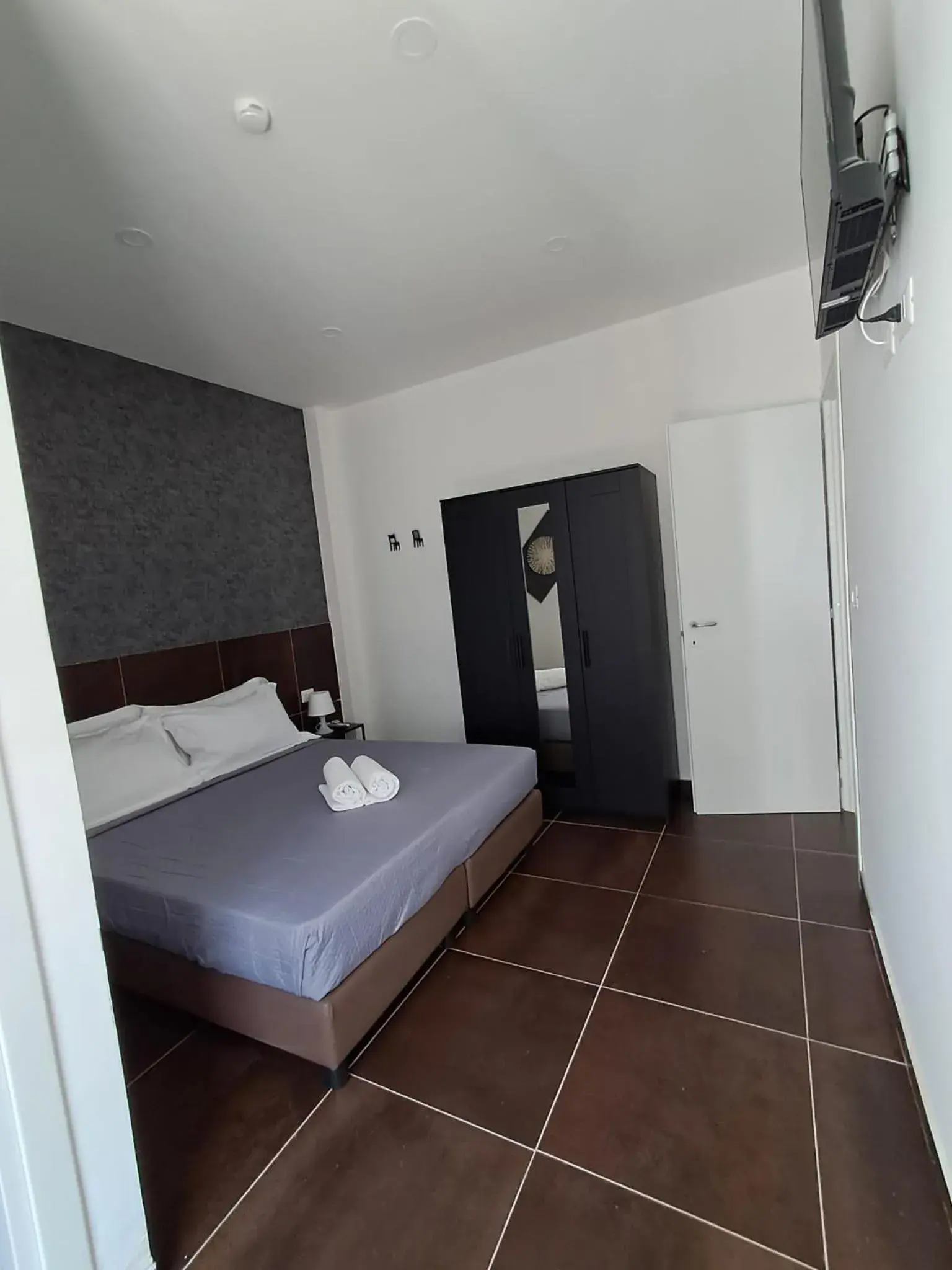 Bed in Hotel apartments Crisvan Bed in Hotel apartments Crisvan