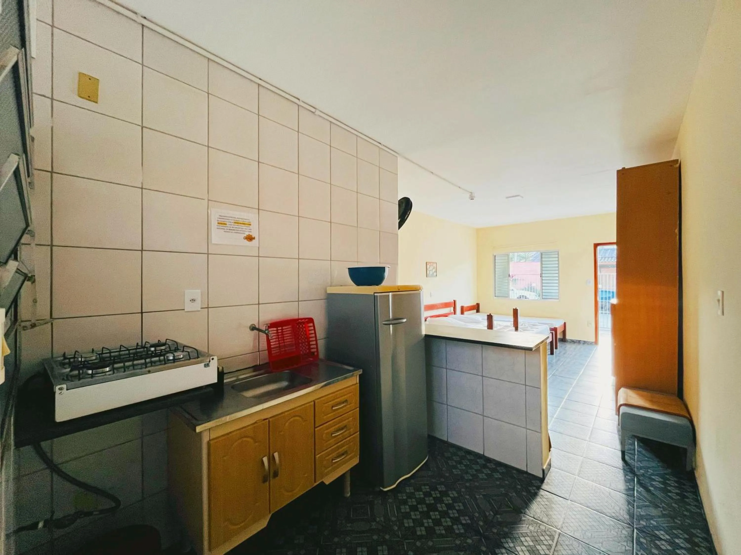 Kitchen or kitchenette in Pousada Caraguá