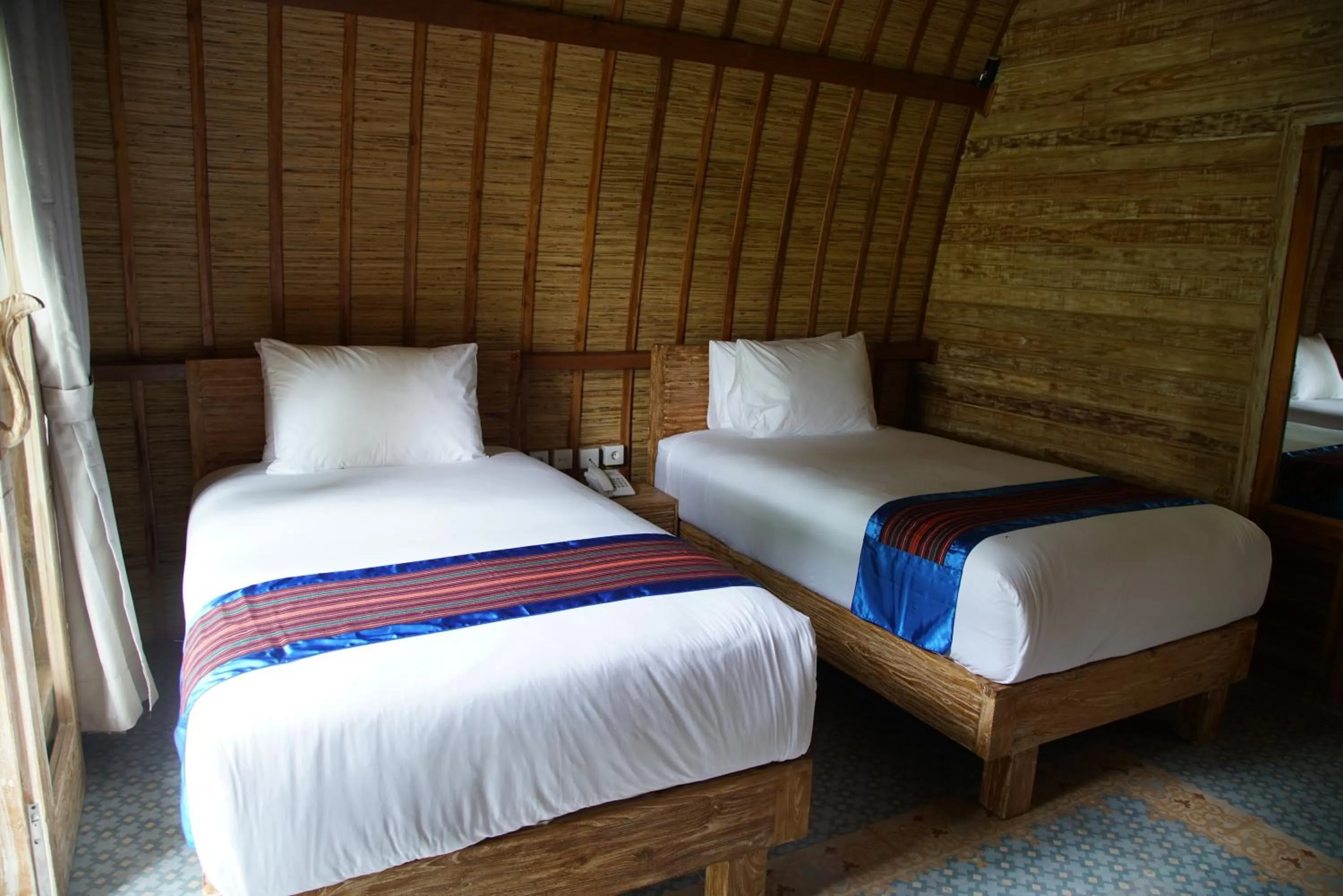 Bed in Puri Rinjani Bungalows & Hostel