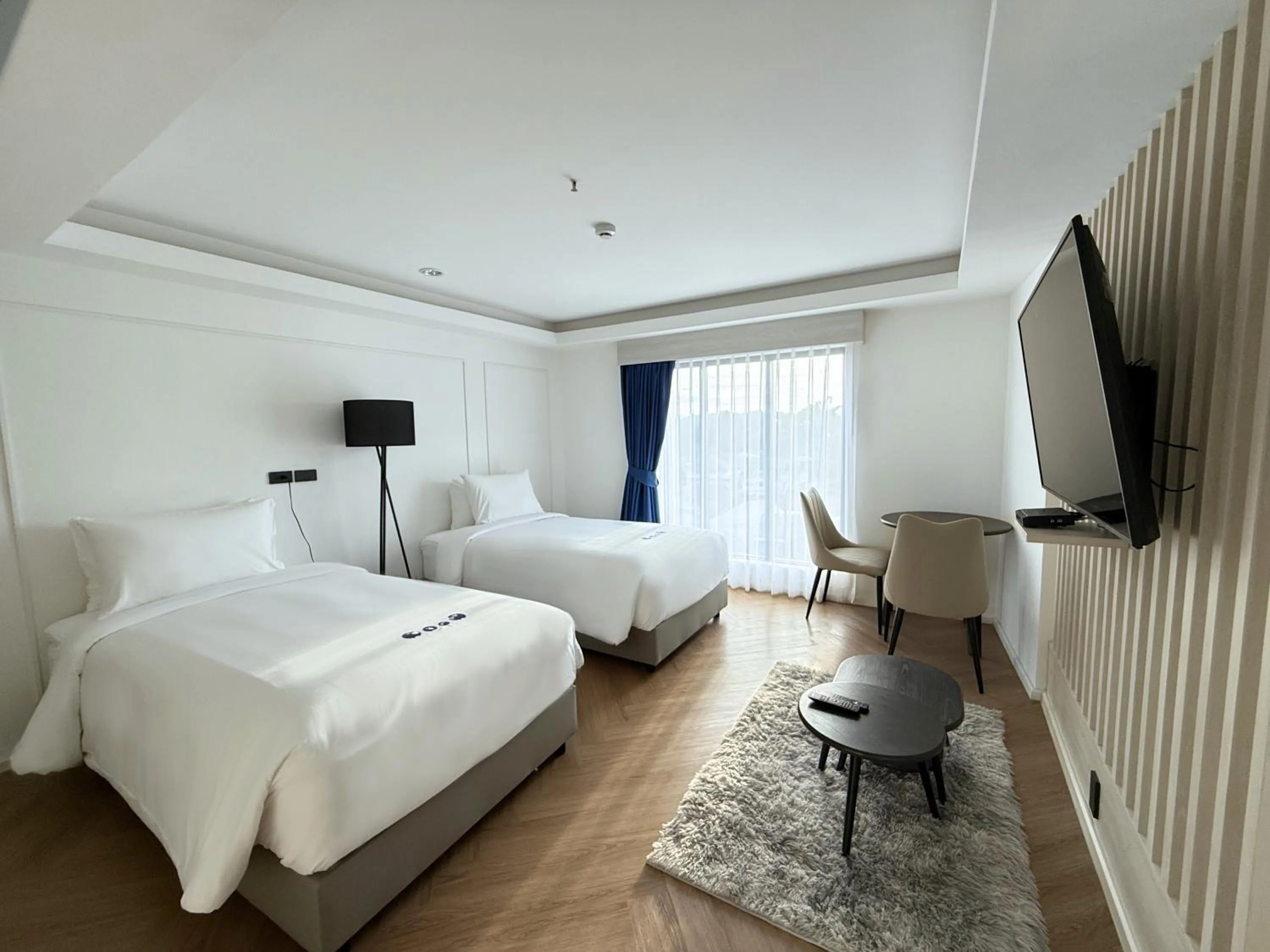 Bed in Kokotel Chiang Rai Airport Suites