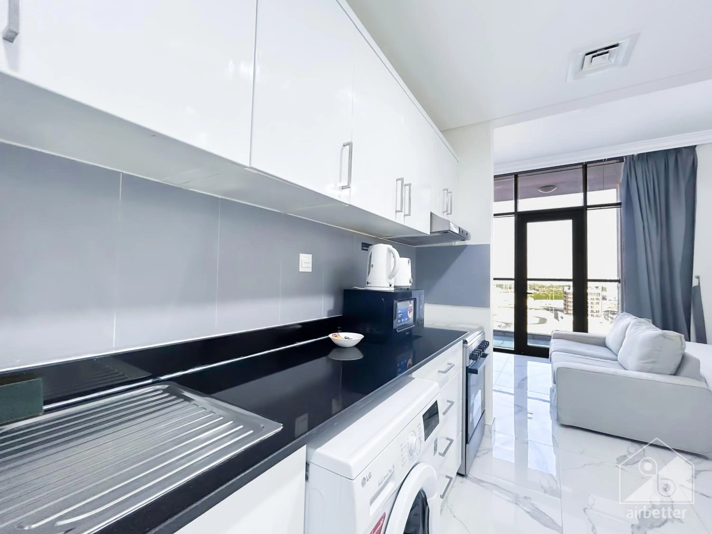 Kitchen or kitchenette in Spacious Studio with balcony in AL Majan