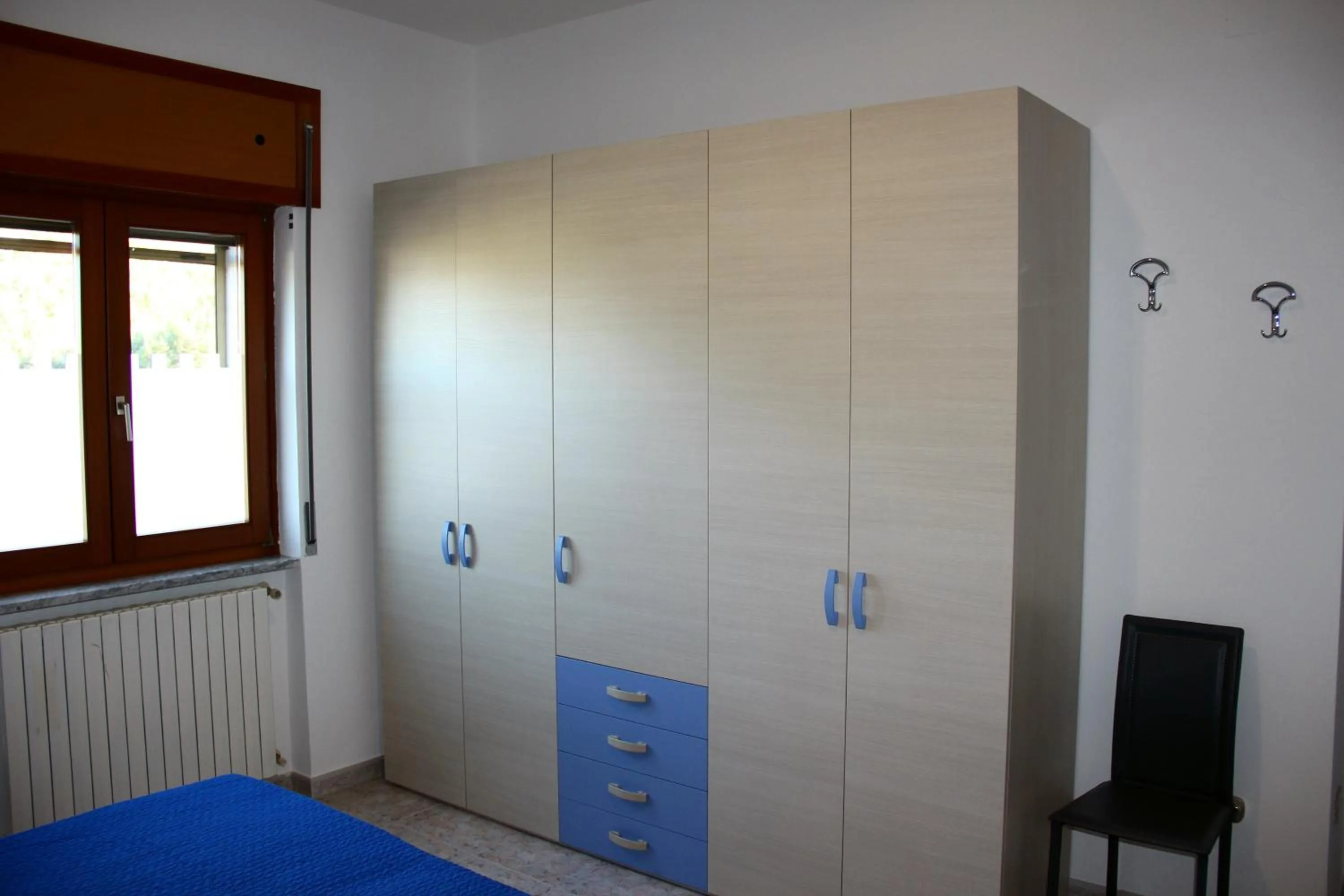 Basic Triple Room with Shared Bathroom - single occupancy in Lucantò Accommodations