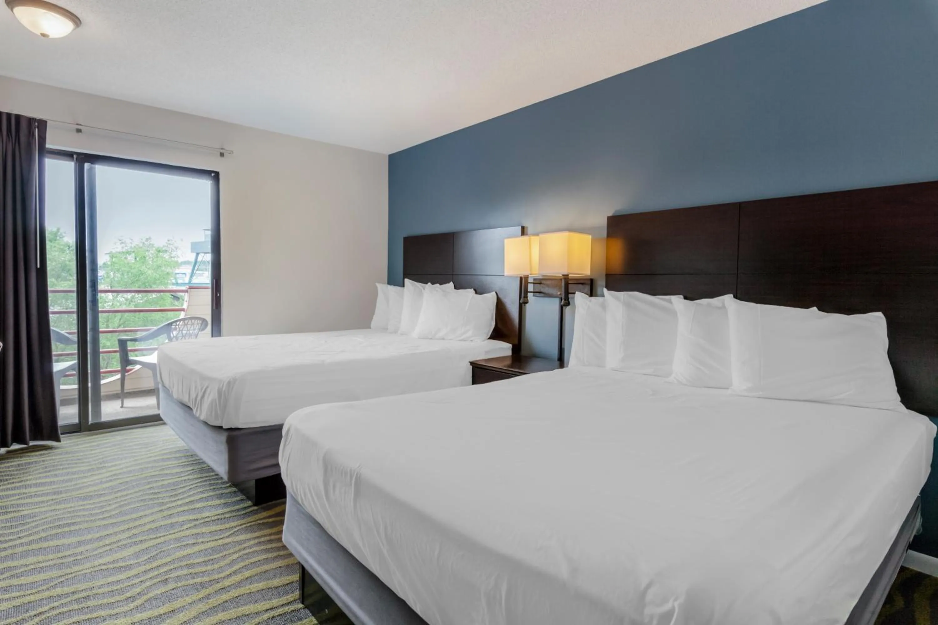 Bed in Atlantis Family Waterpark Hotel, an Ascend Collection Hotel