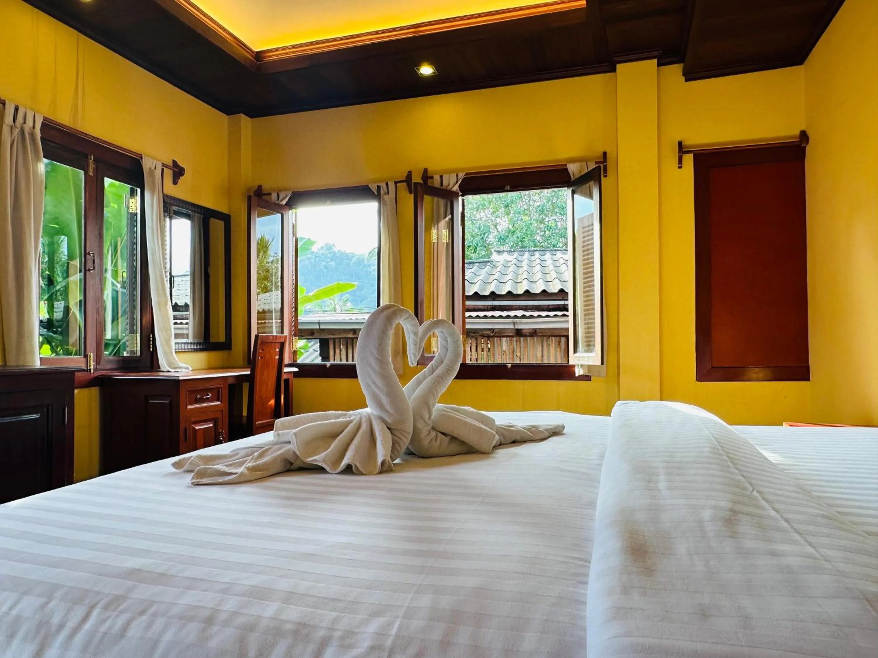 Bed in Villa Phonethip Mekong Riverside