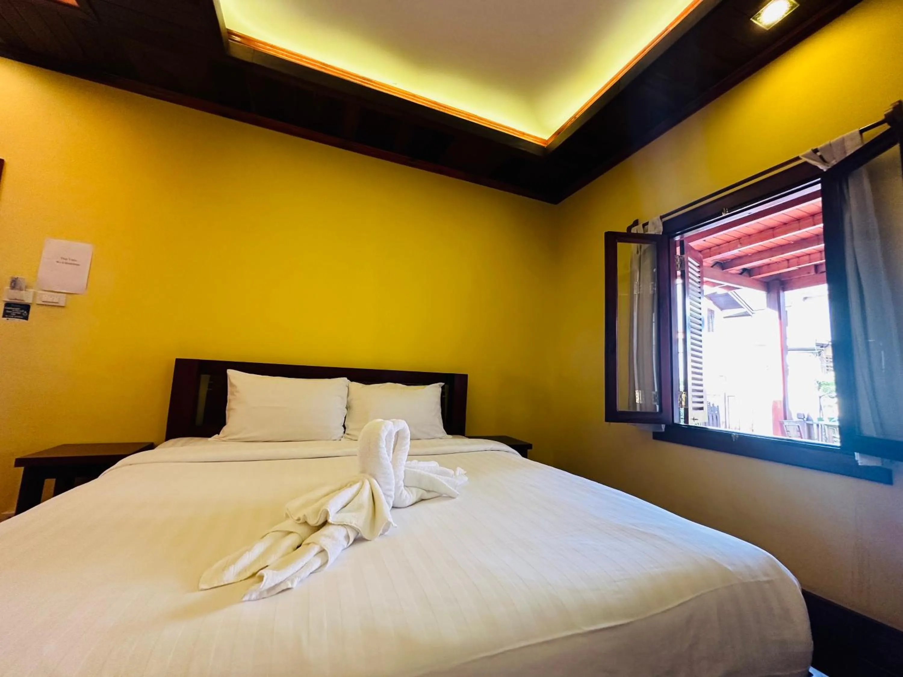 Bed in Villa Phonethip Mekong Riverside