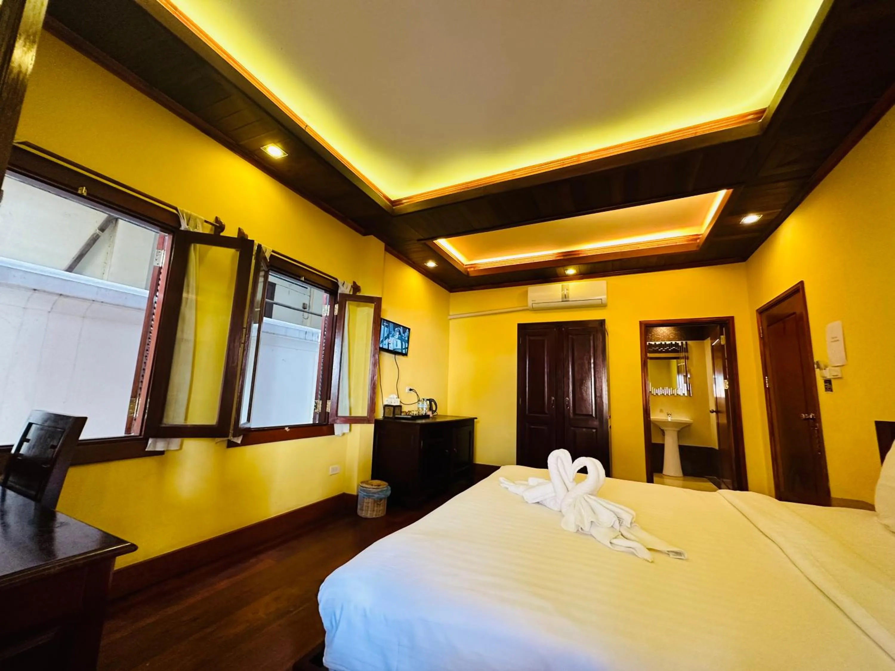 Bed in Villa Phonethip Mekong Riverside