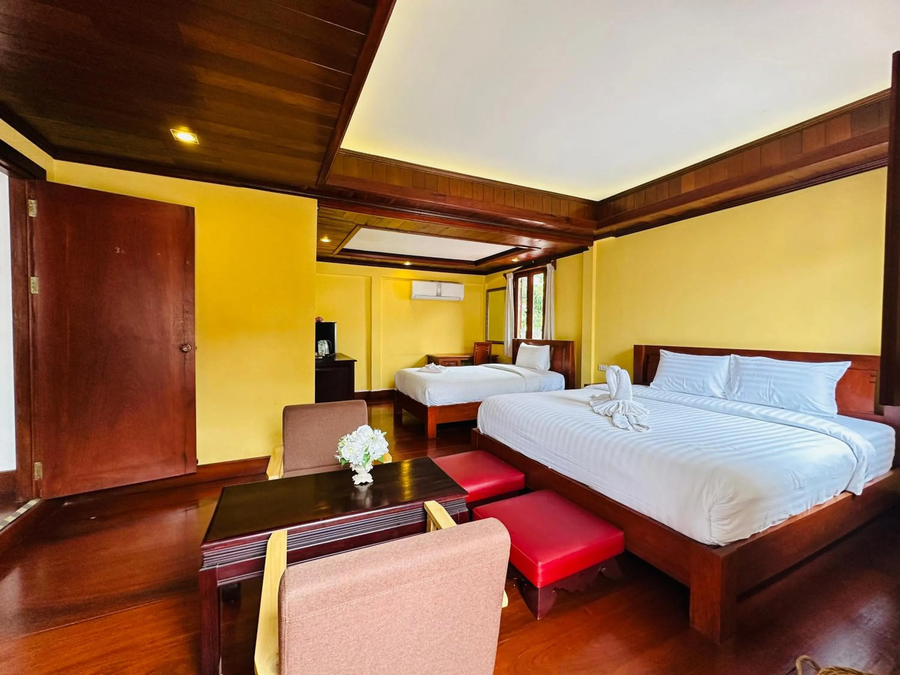 Bed in Villa Phonethip Mekong Riverside