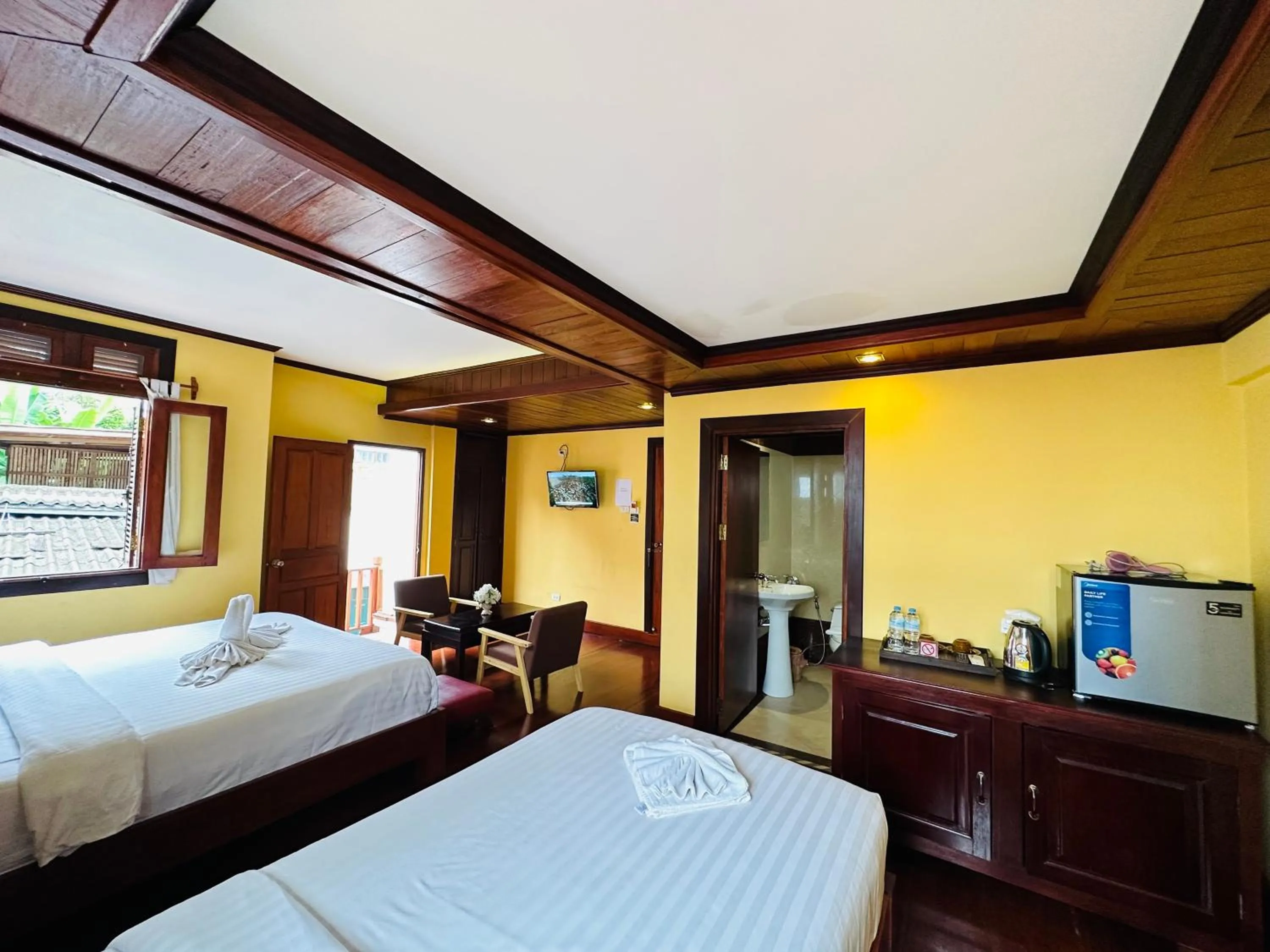 Bed in Villa Phonethip Mekong Riverside