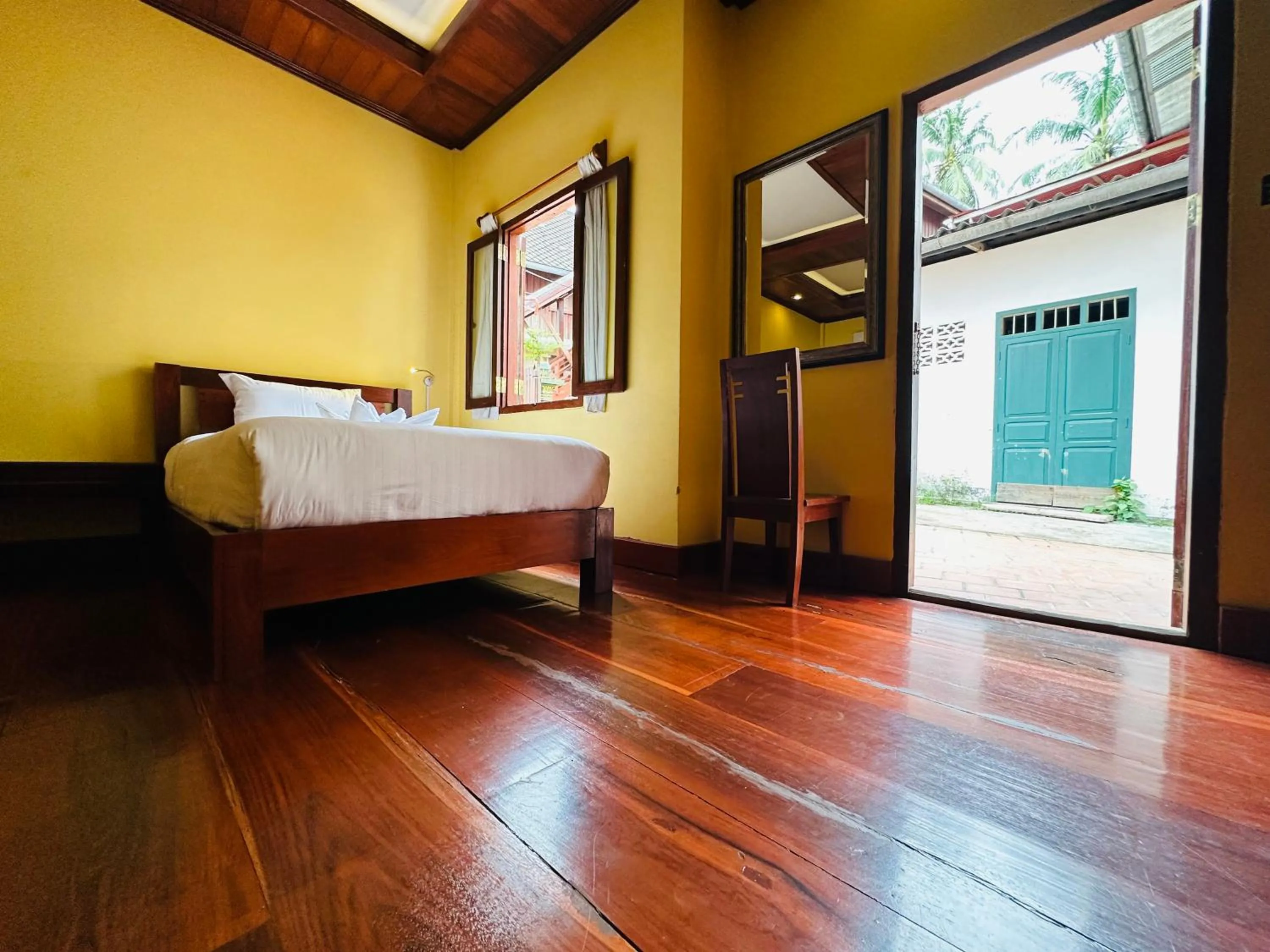 Bed in Villa Phonethip Mekong Riverside