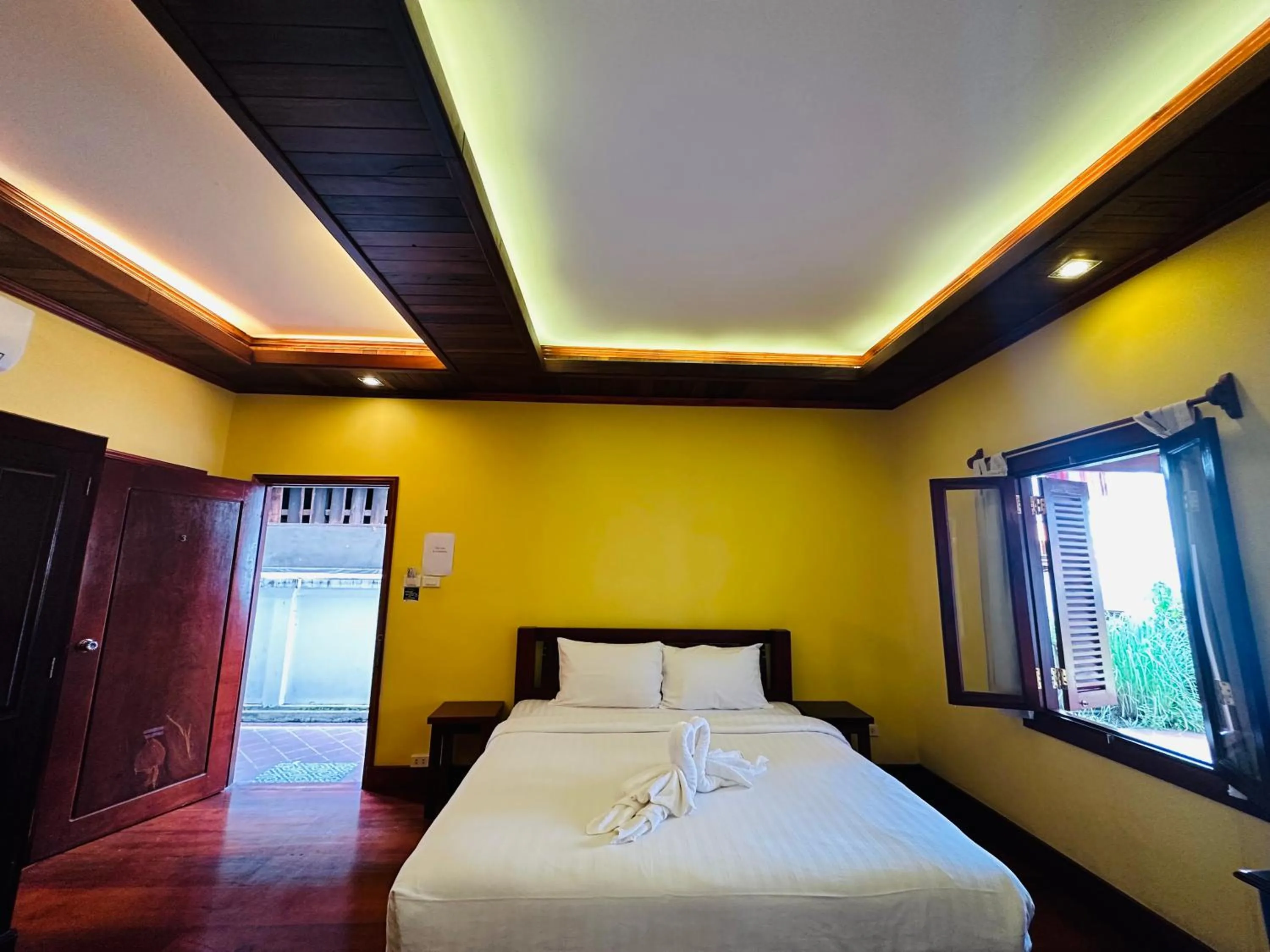 Bed in Villa Phonethip Mekong Riverside