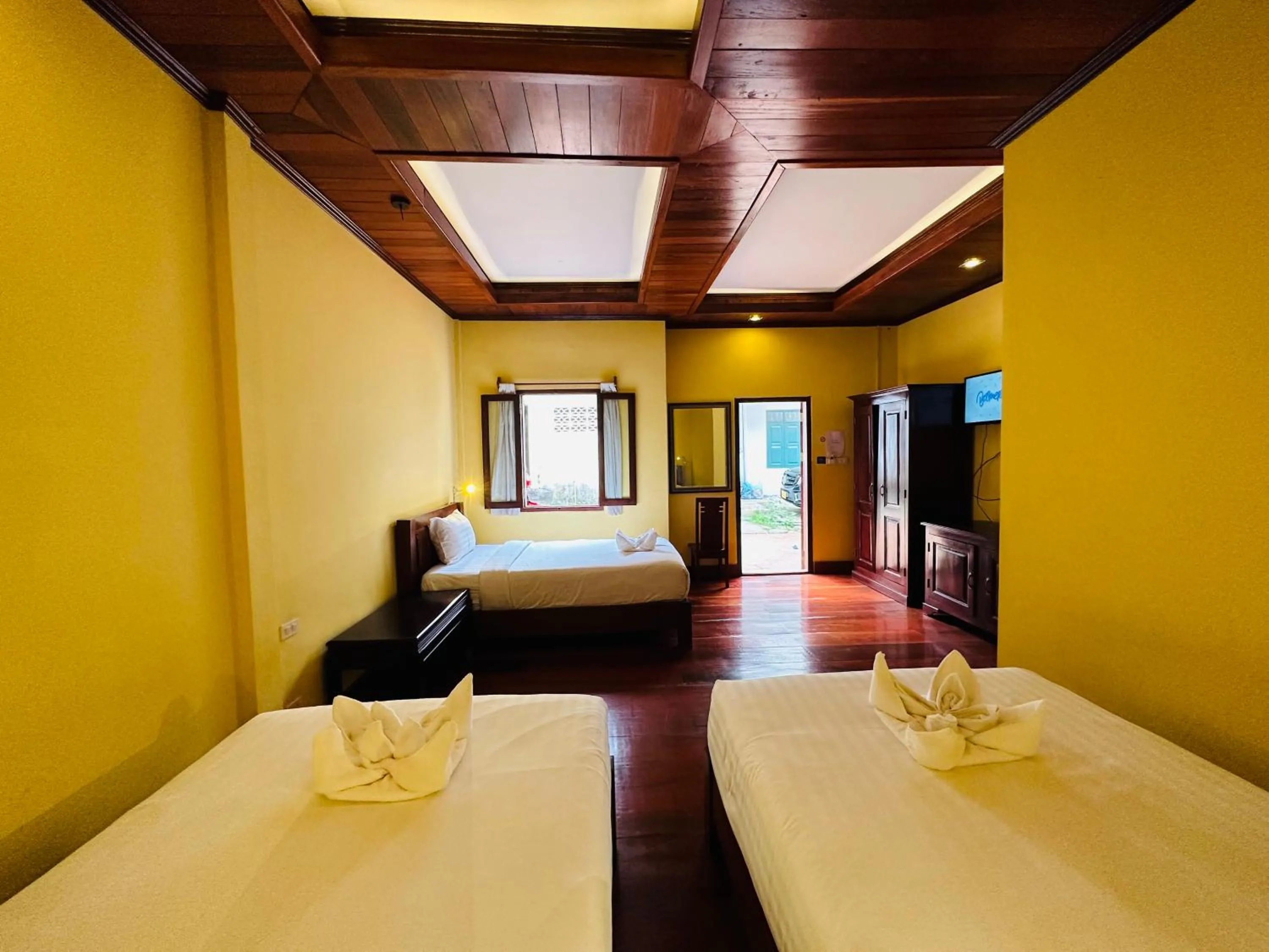 Bed in Villa Phonethip Mekong Riverside