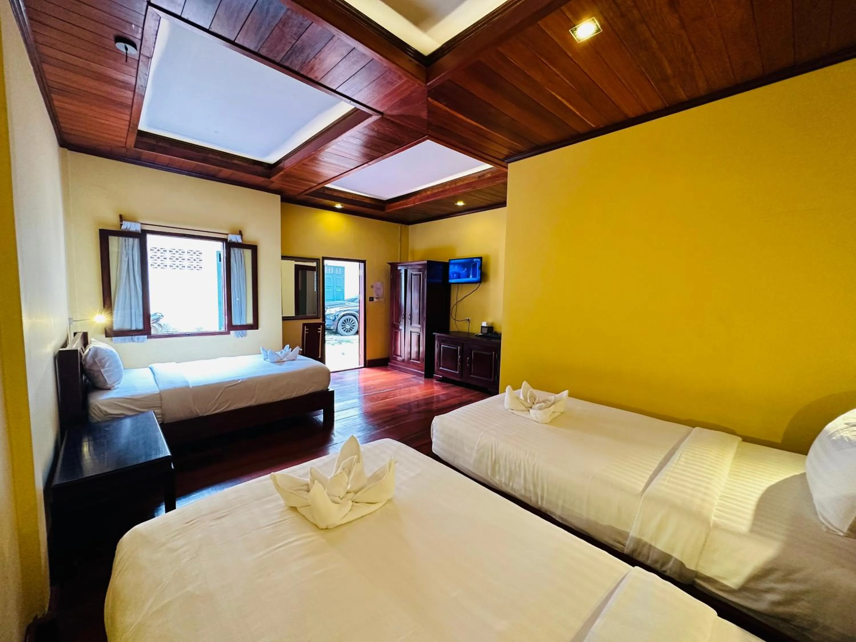 Bed in Villa Phonethip Mekong Riverside