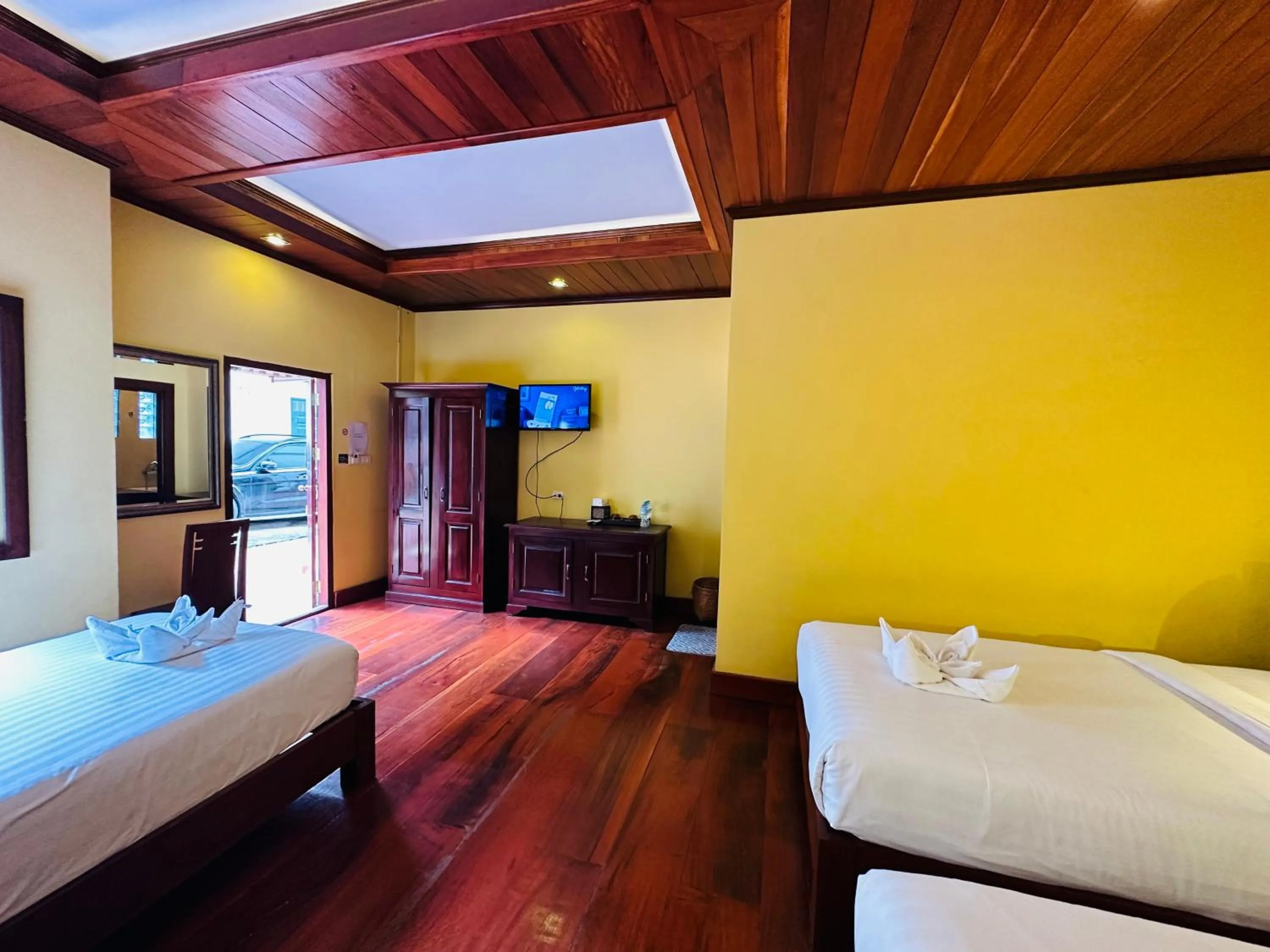 Communal lounge/ TV room, Bed in Villa Phonethip Mekong Riverside