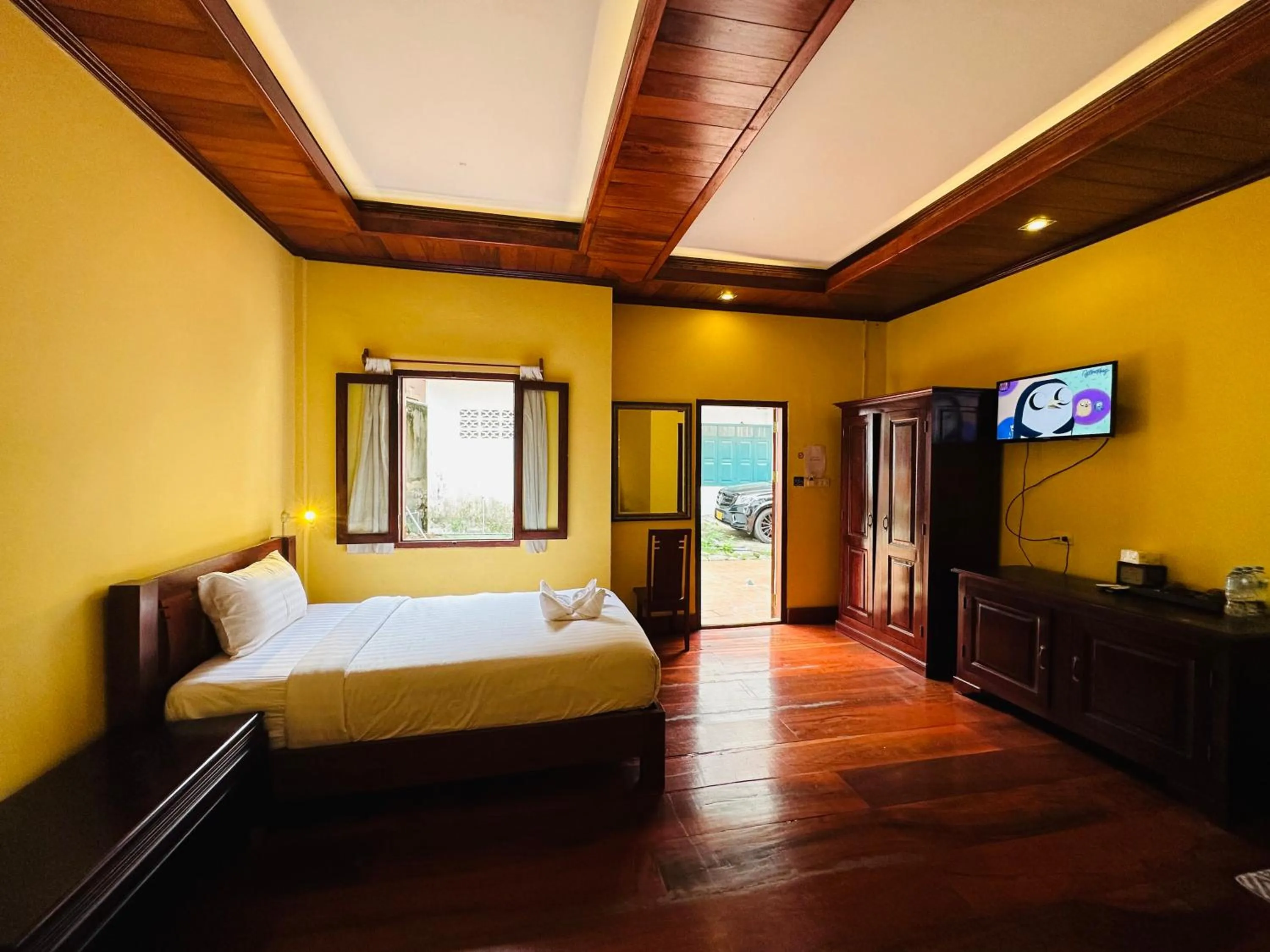 Communal lounge/ TV room, Bed in Villa Phonethip Mekong Riverside