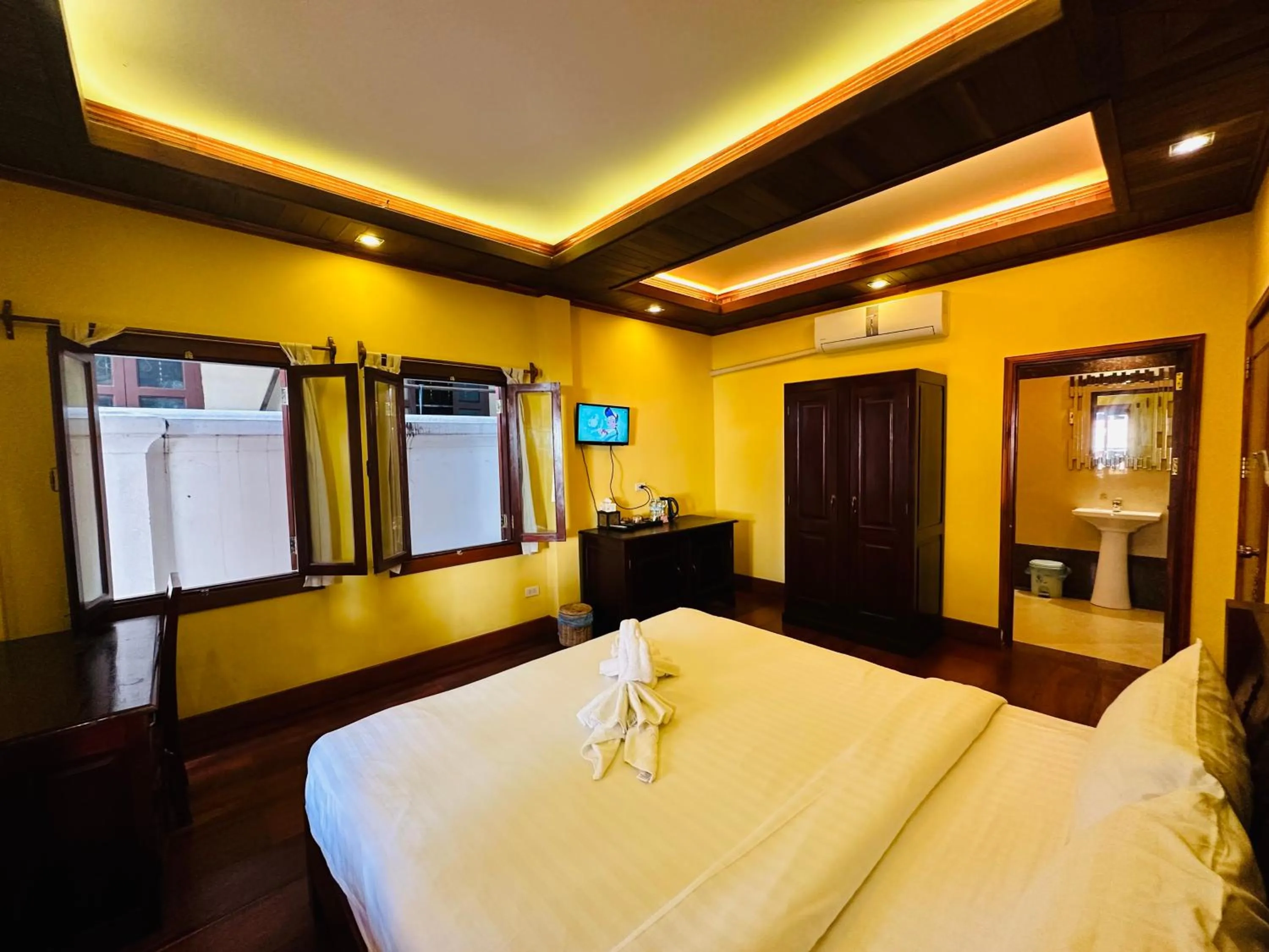 Bed in Villa Phonethip Mekong Riverside