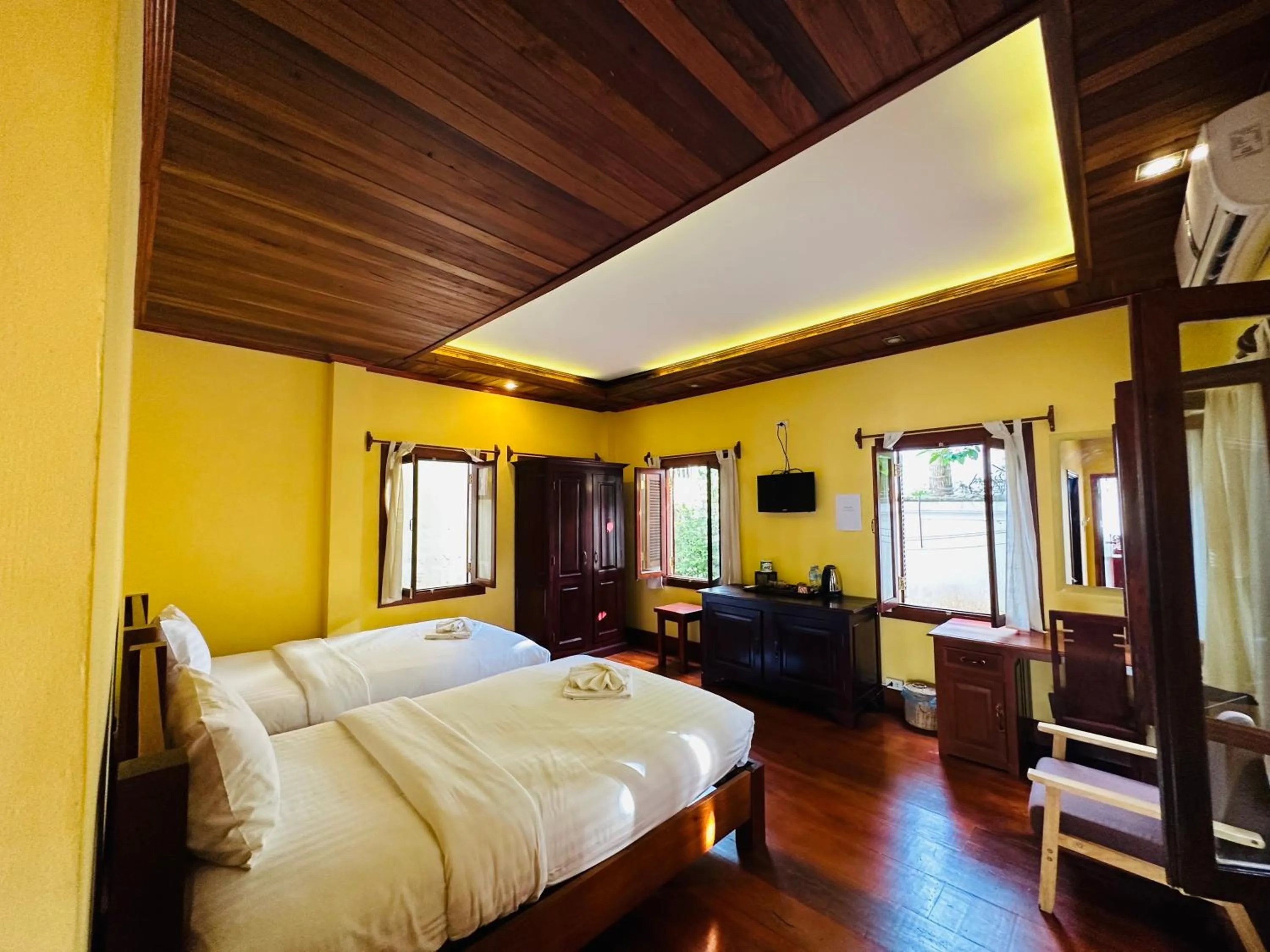 Communal lounge/ TV room, Bed in Villa Phonethip Mekong Riverside