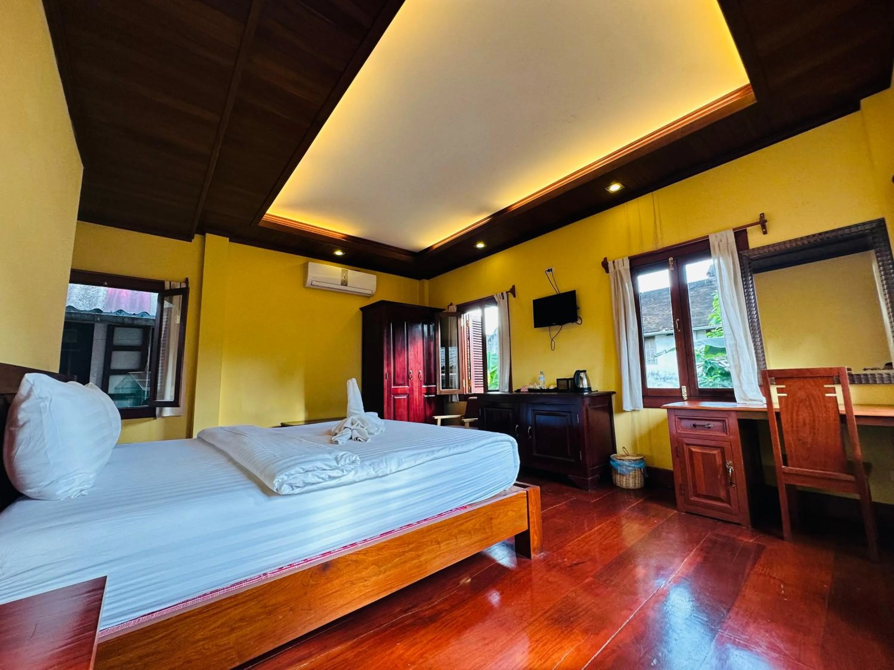 Communal lounge/ TV room, Bed in Villa Phonethip Mekong Riverside