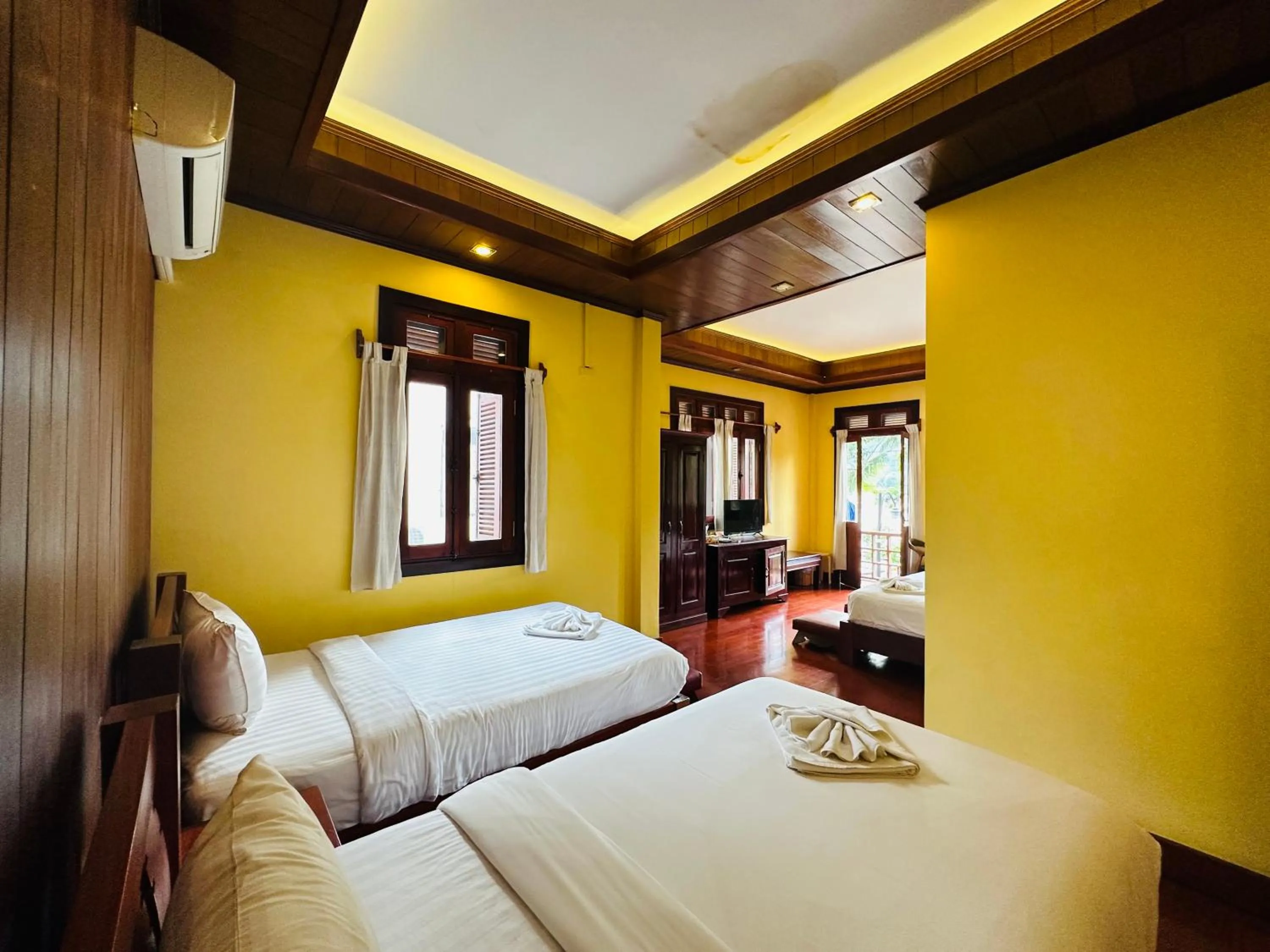 Bed in Villa Phonethip Mekong Riverside