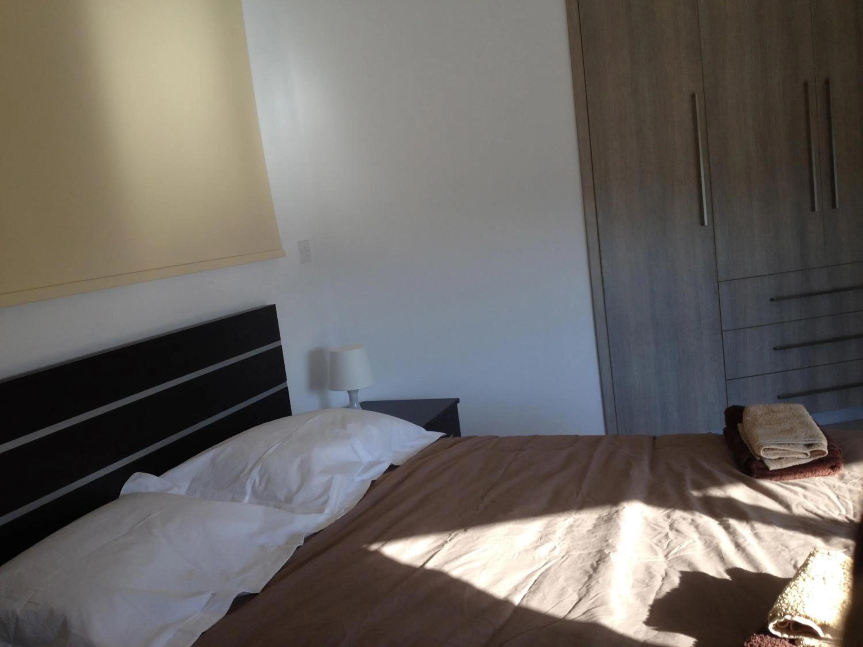 Day, Bed in Niro Apartments