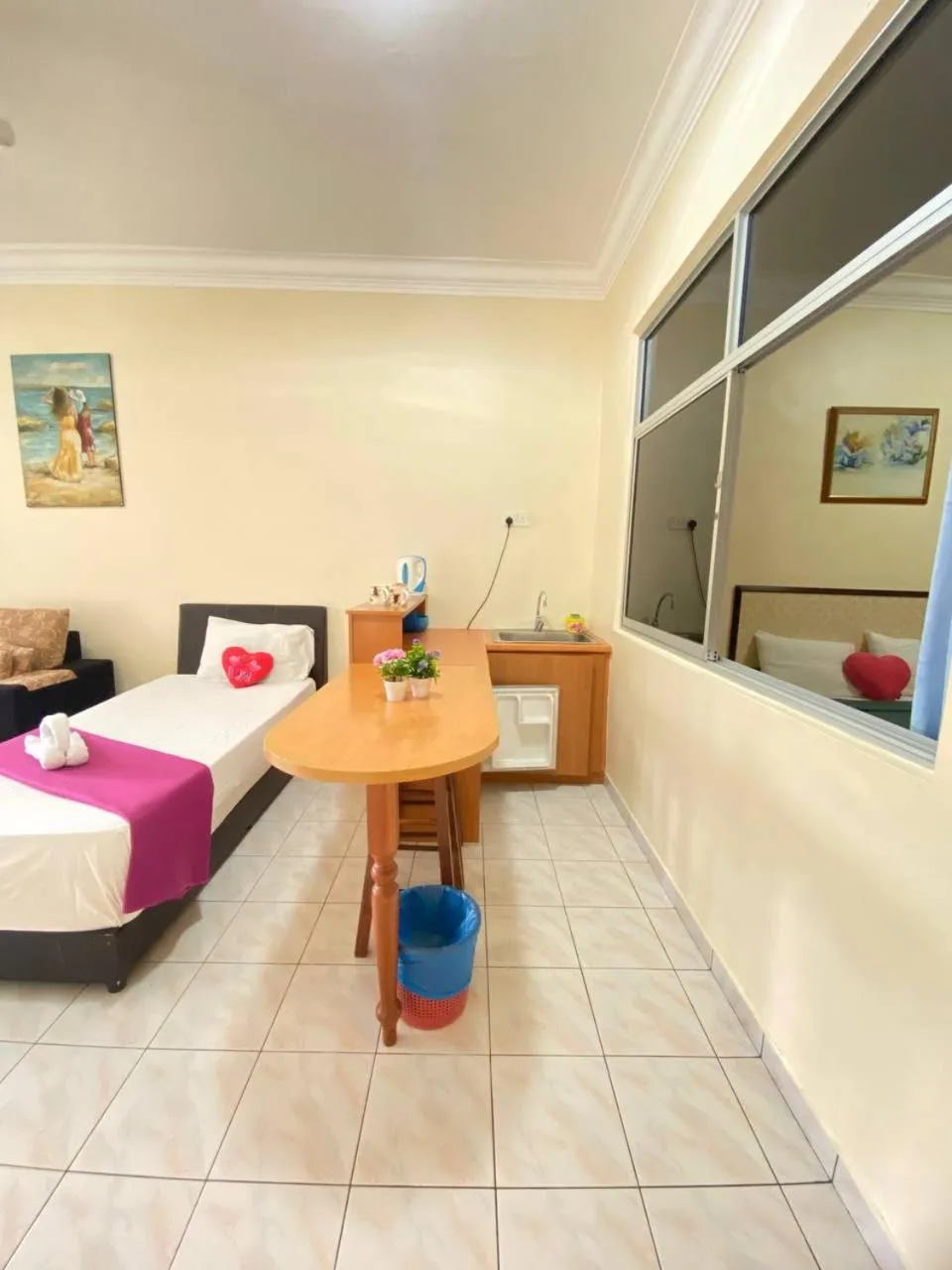 Kitchen or kitchenette, Bed in Teluk Batik Holiday Apartment