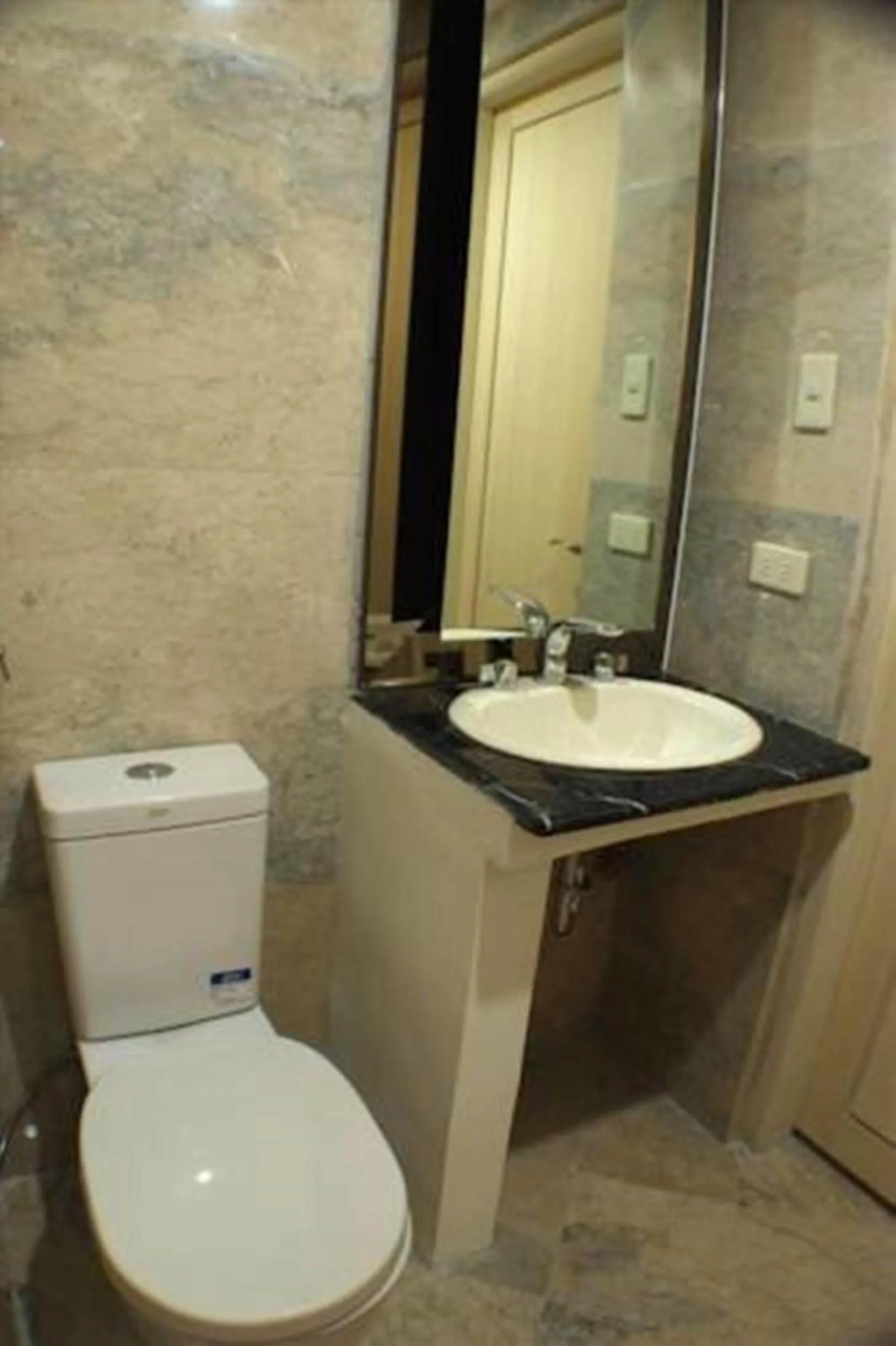 Toilet in The Penthouse Hotel and Residences
