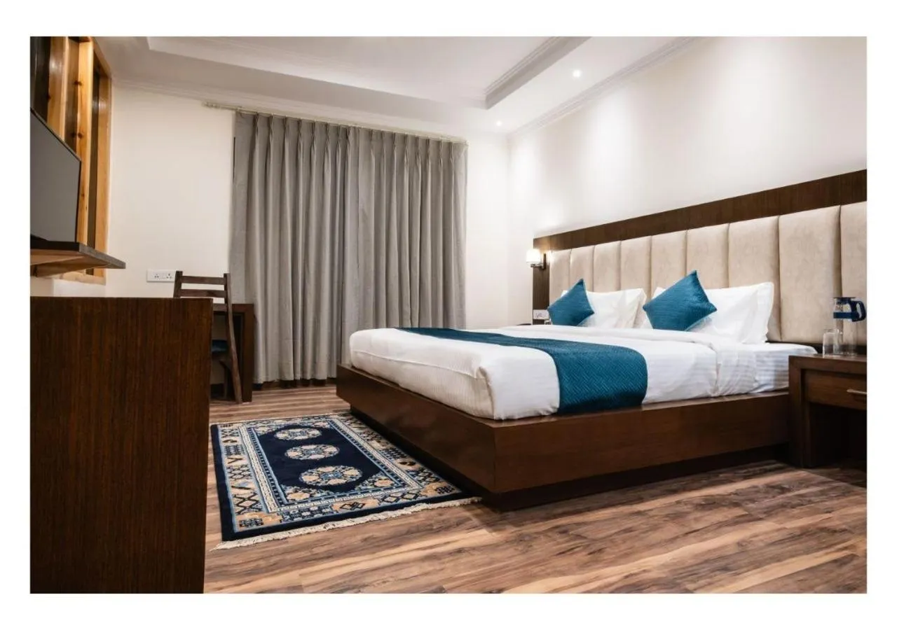 Bed in Hotel Kharu Vilaasa