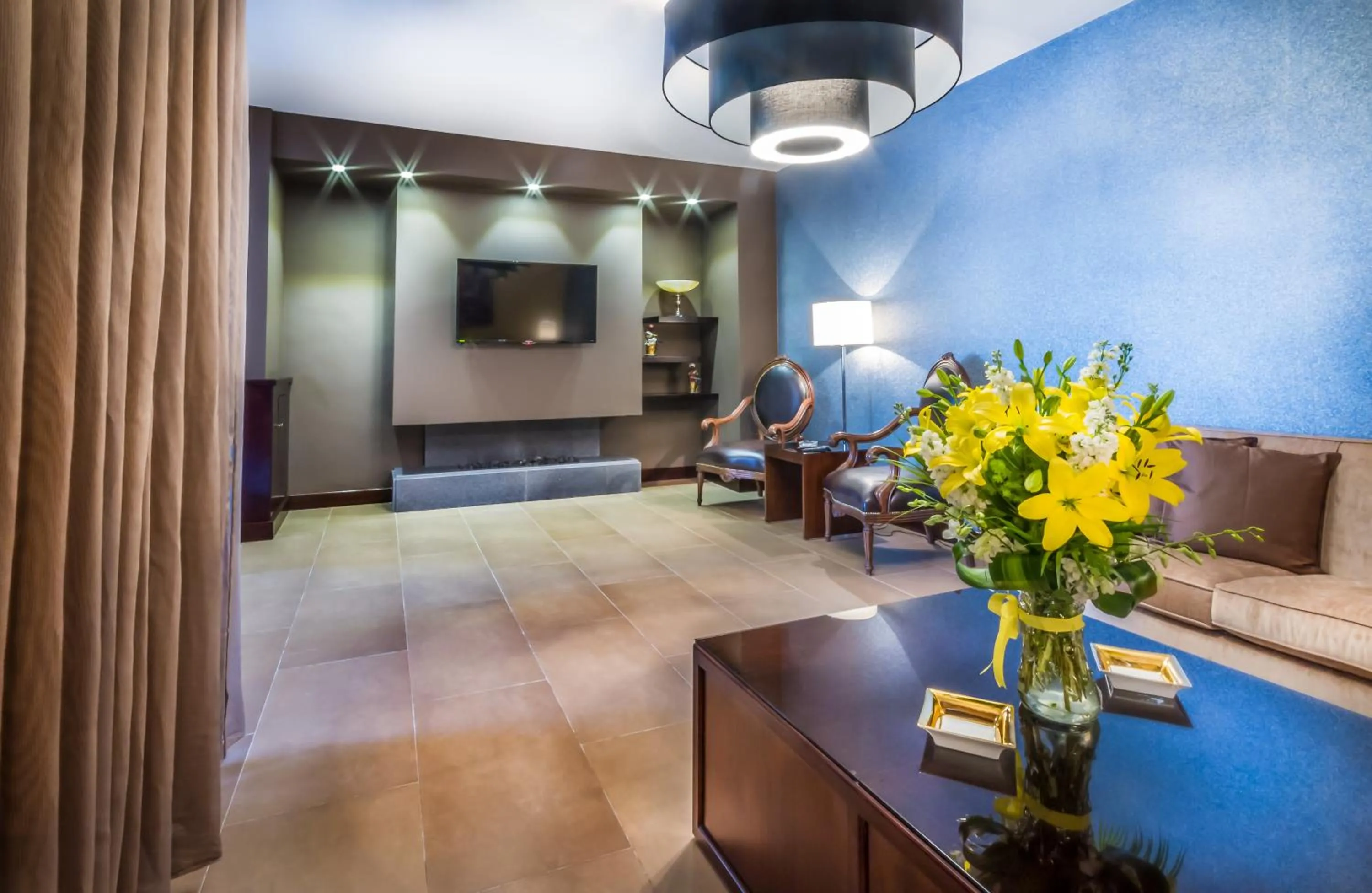 Communal lounge/ TV room in Nadine Hotel Suites