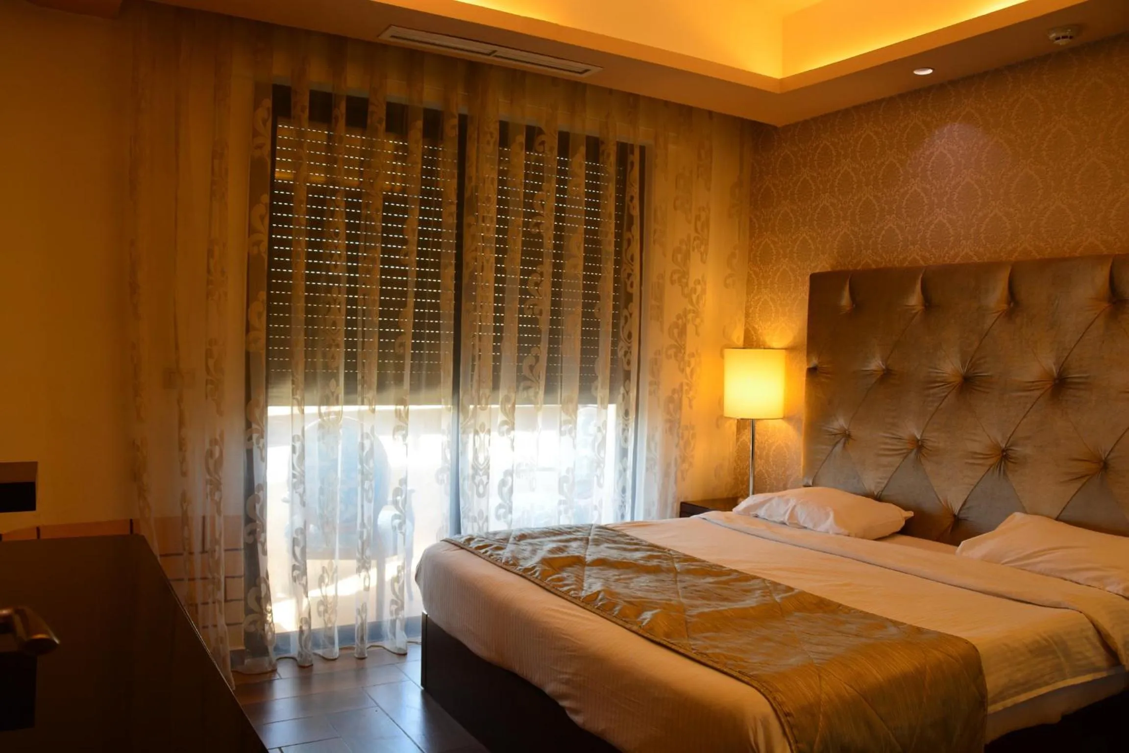 Bed in Nadine Hotel Suites