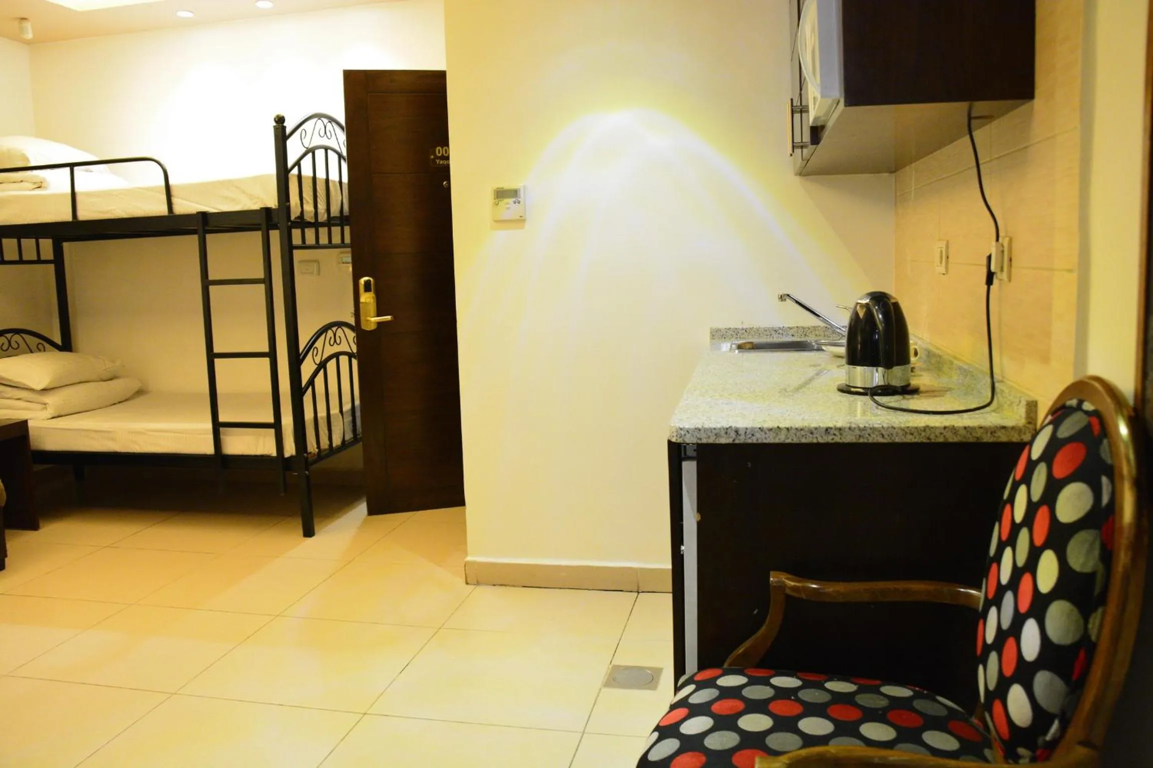 TV and multimedia, Bed in Nadine Hotel Suites