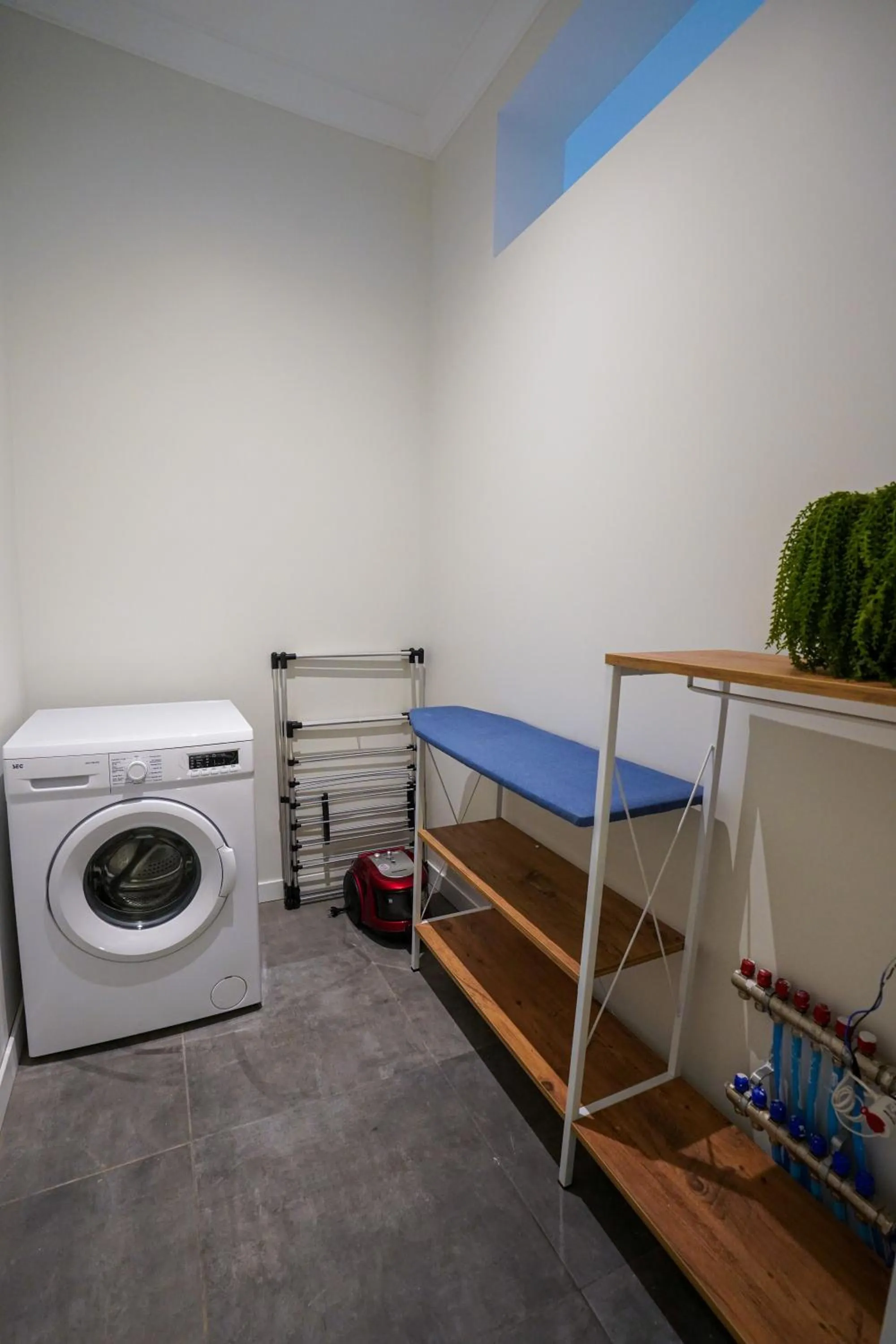 washing machine, Bed in Merkuri apartments