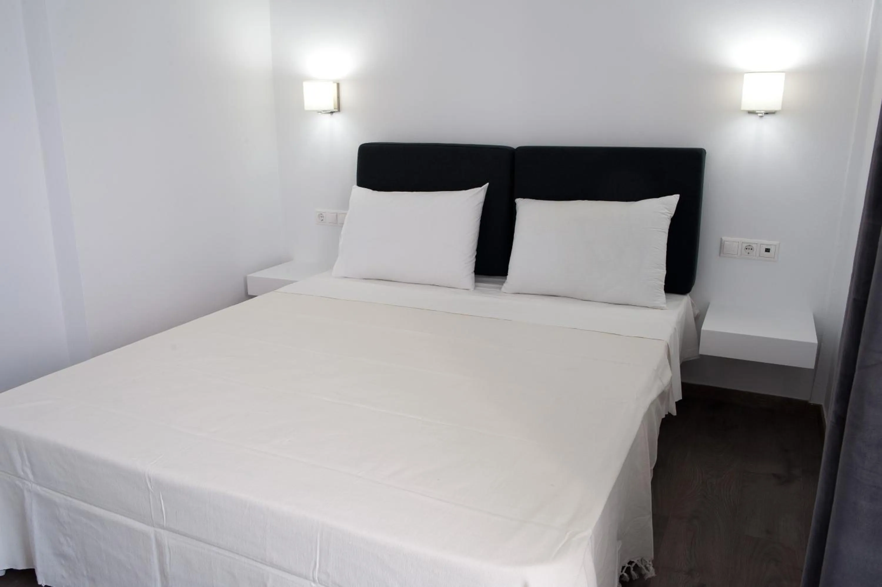 Bed in Aestas Apartments