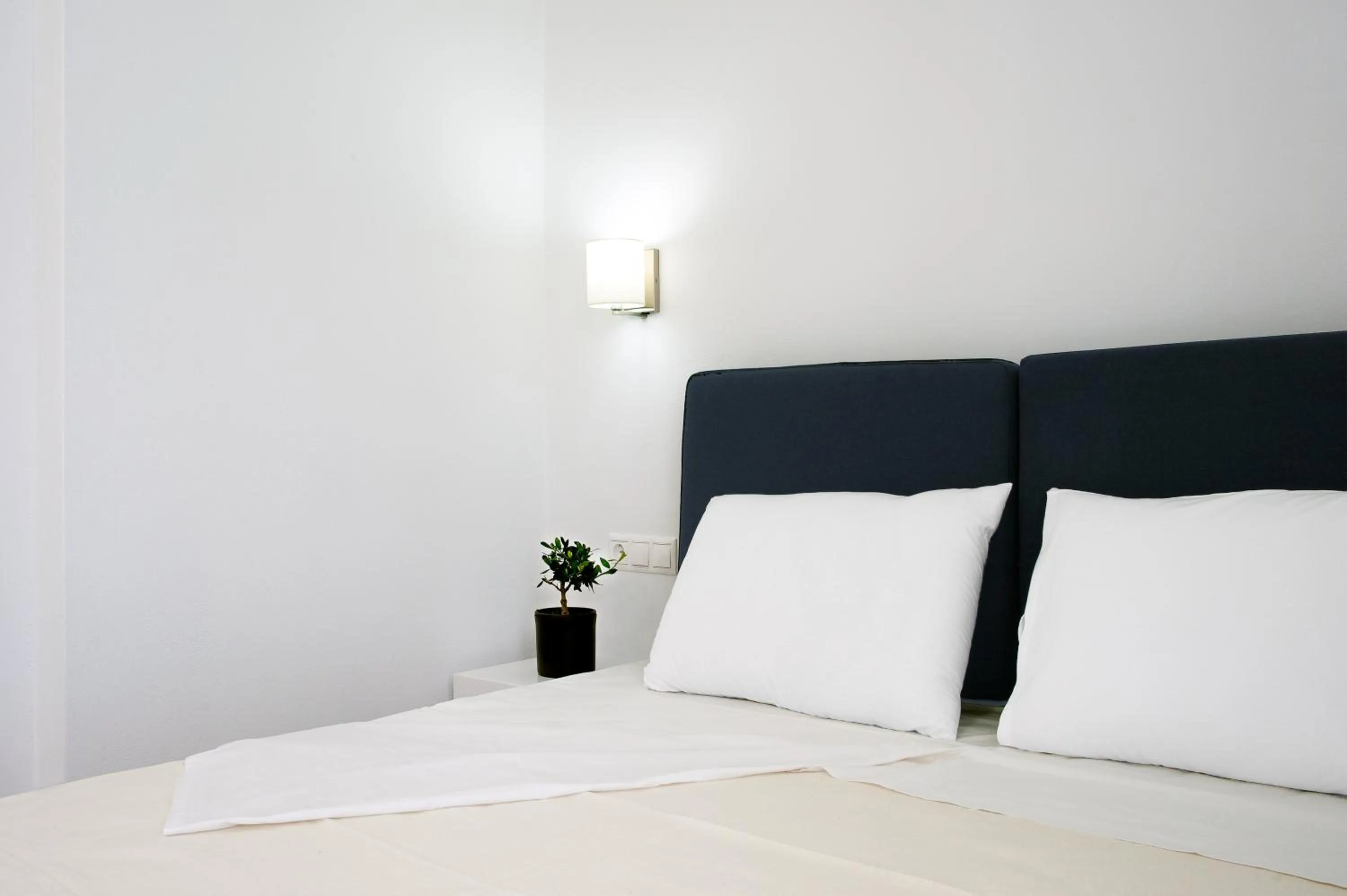 Bed in Aestas Apartments
