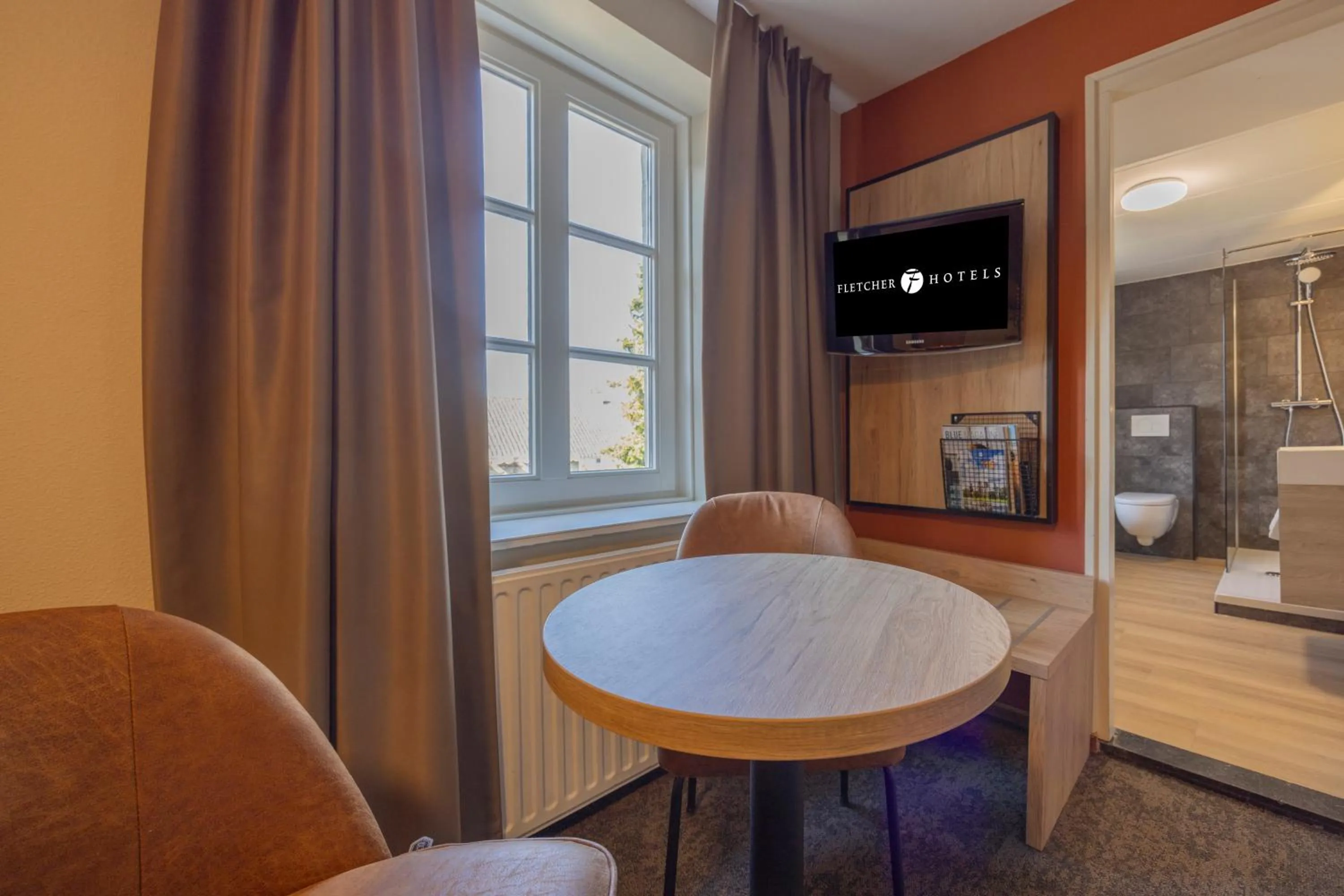 Seating area in Fletcher Hotel Restaurant De Burghoeve