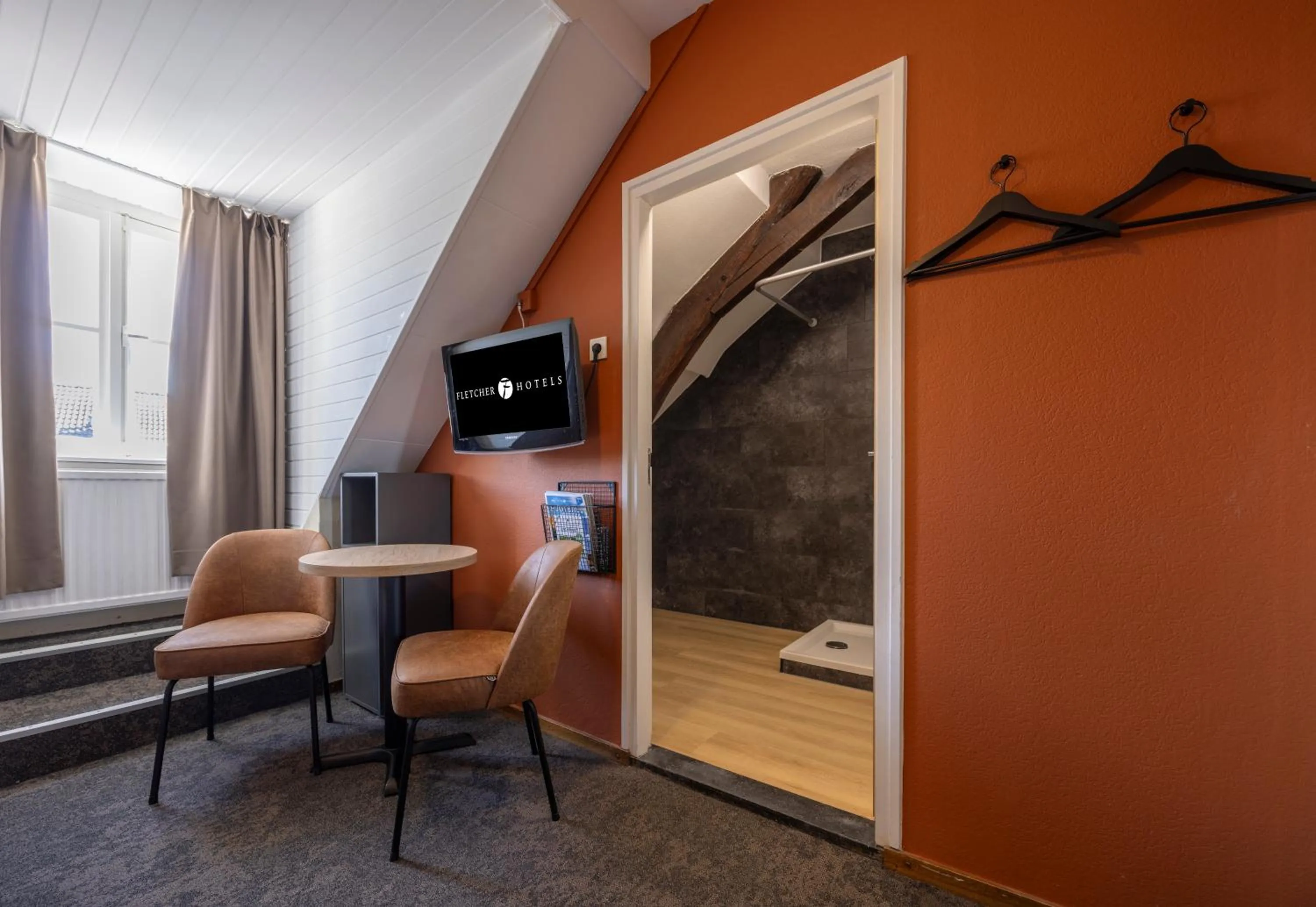 Seating area in Fletcher Hotel Restaurant De Burghoeve