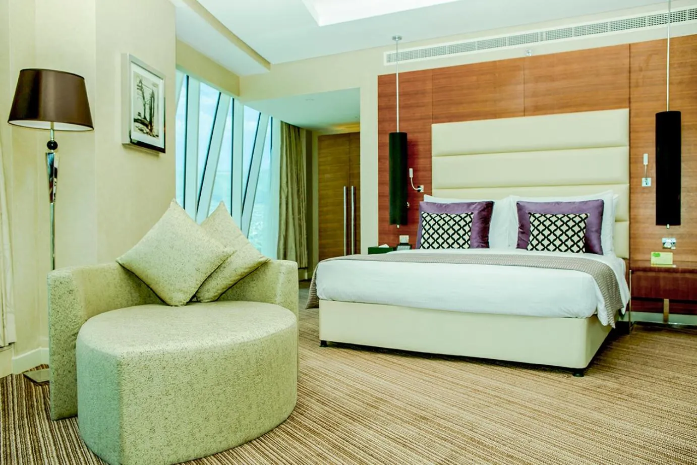 Living room, Bed in Grand Millennium Sulaimani