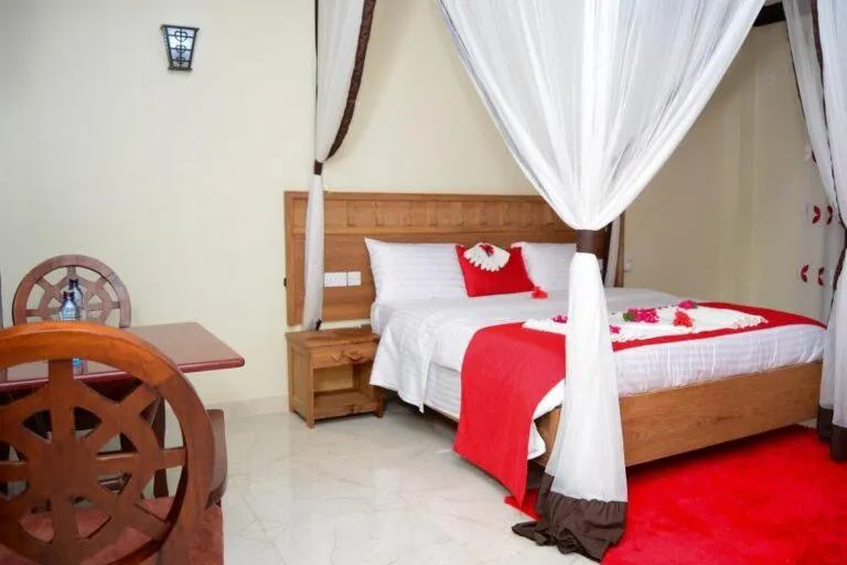 Bed in White Peacock Resort Mtwapa