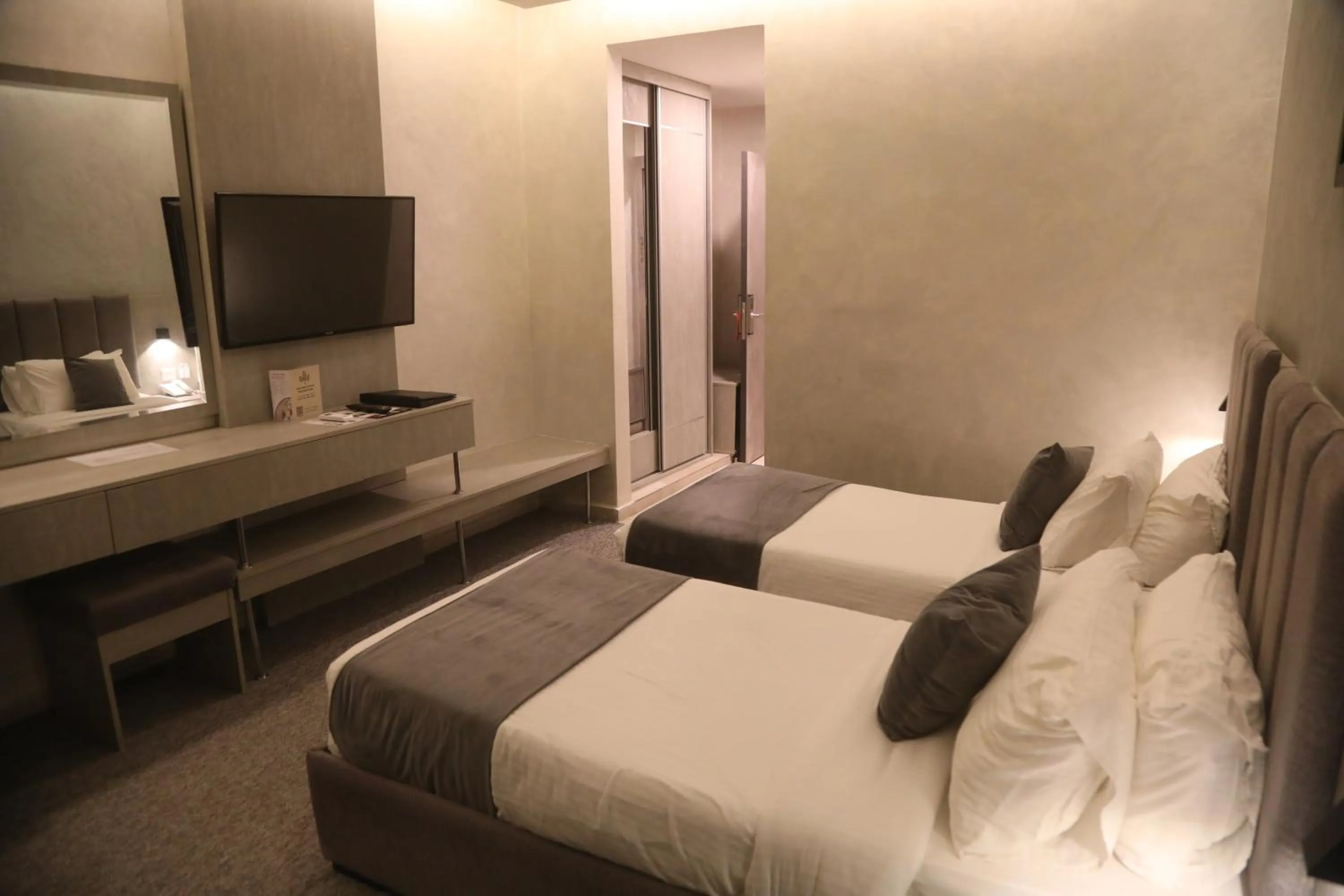 Bed in Kaya Hotel Amman