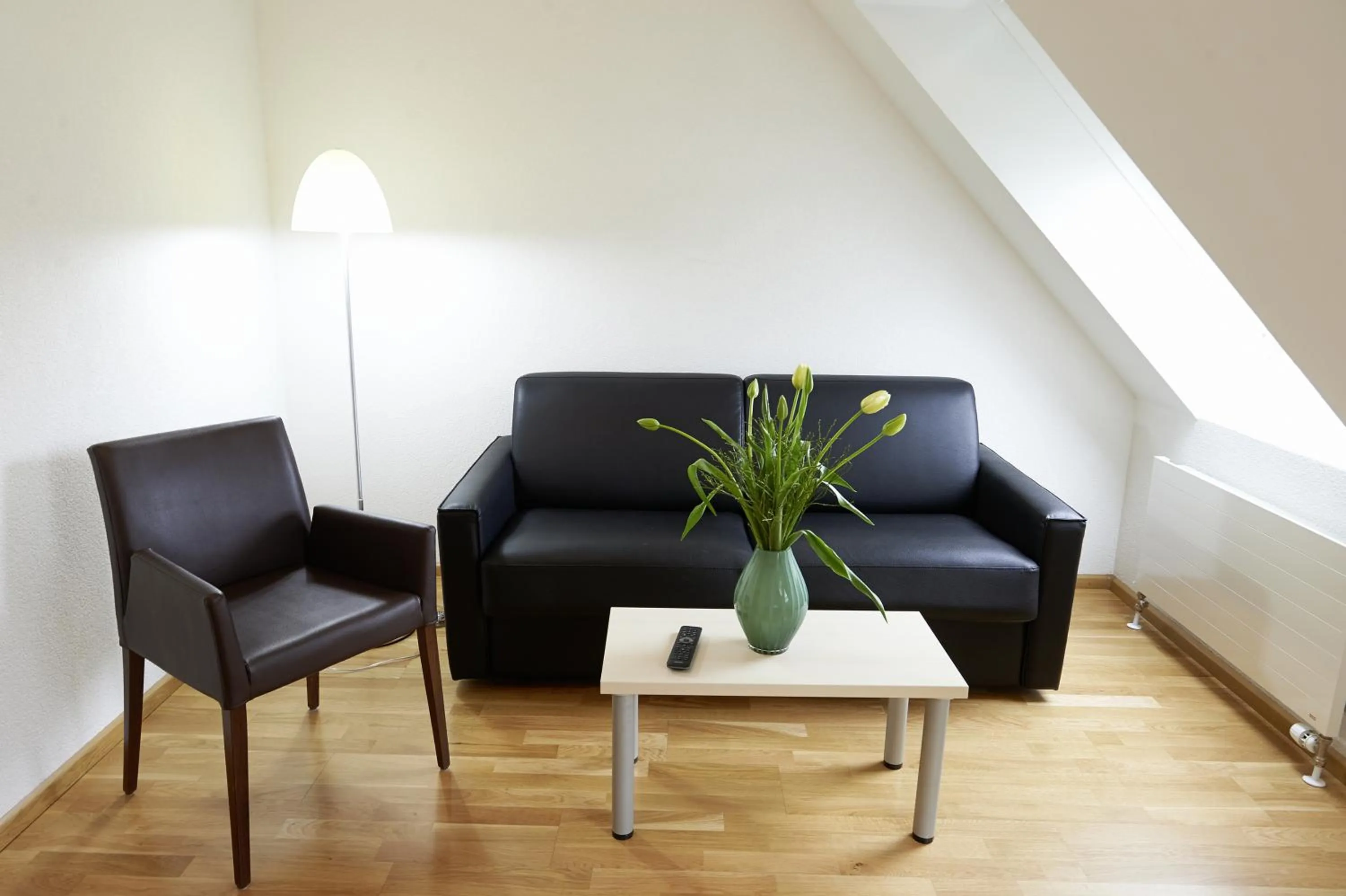 Living room in Residence Apartments by Hotel du Commerce