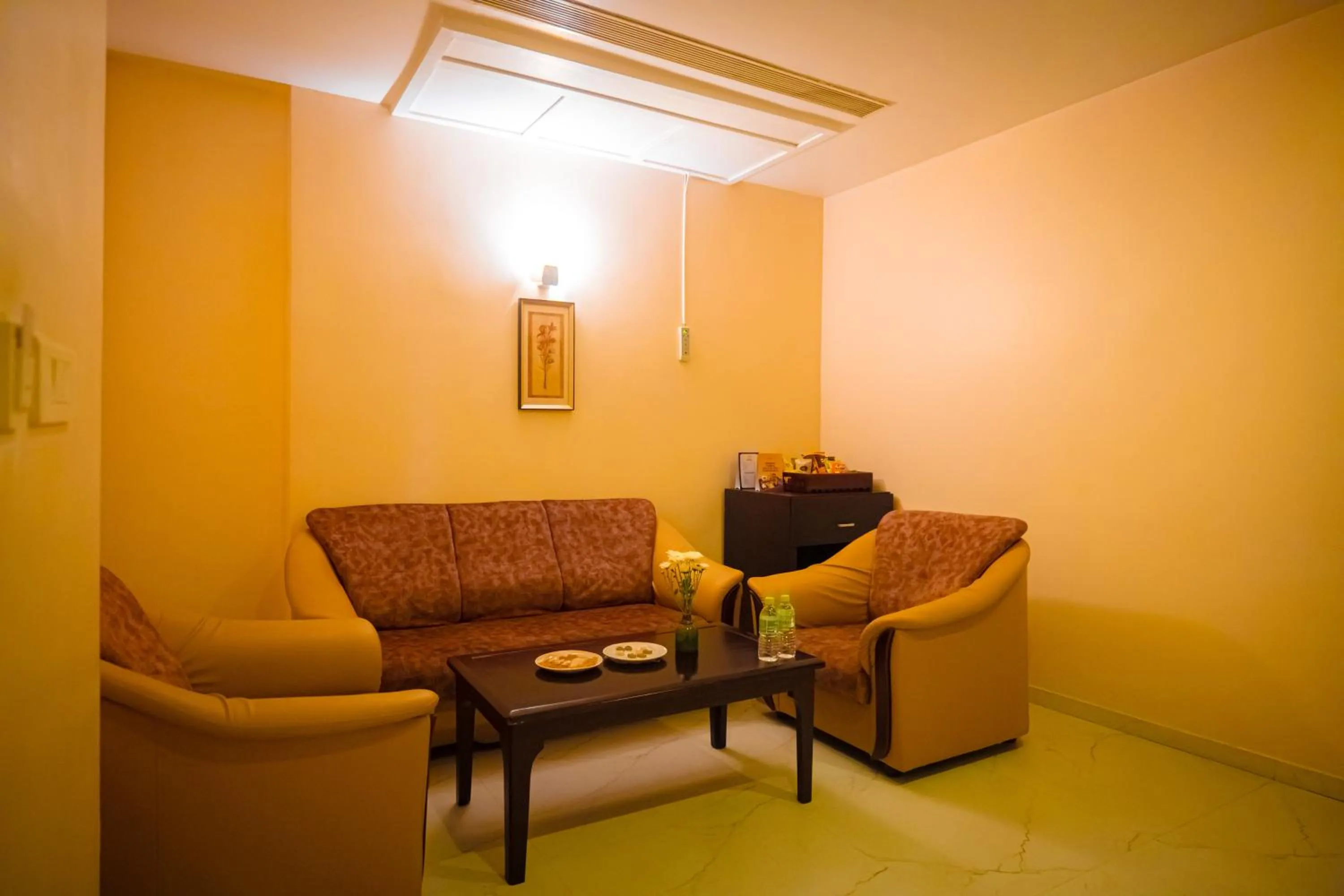 Seating area in Poppys Hotel Madurai