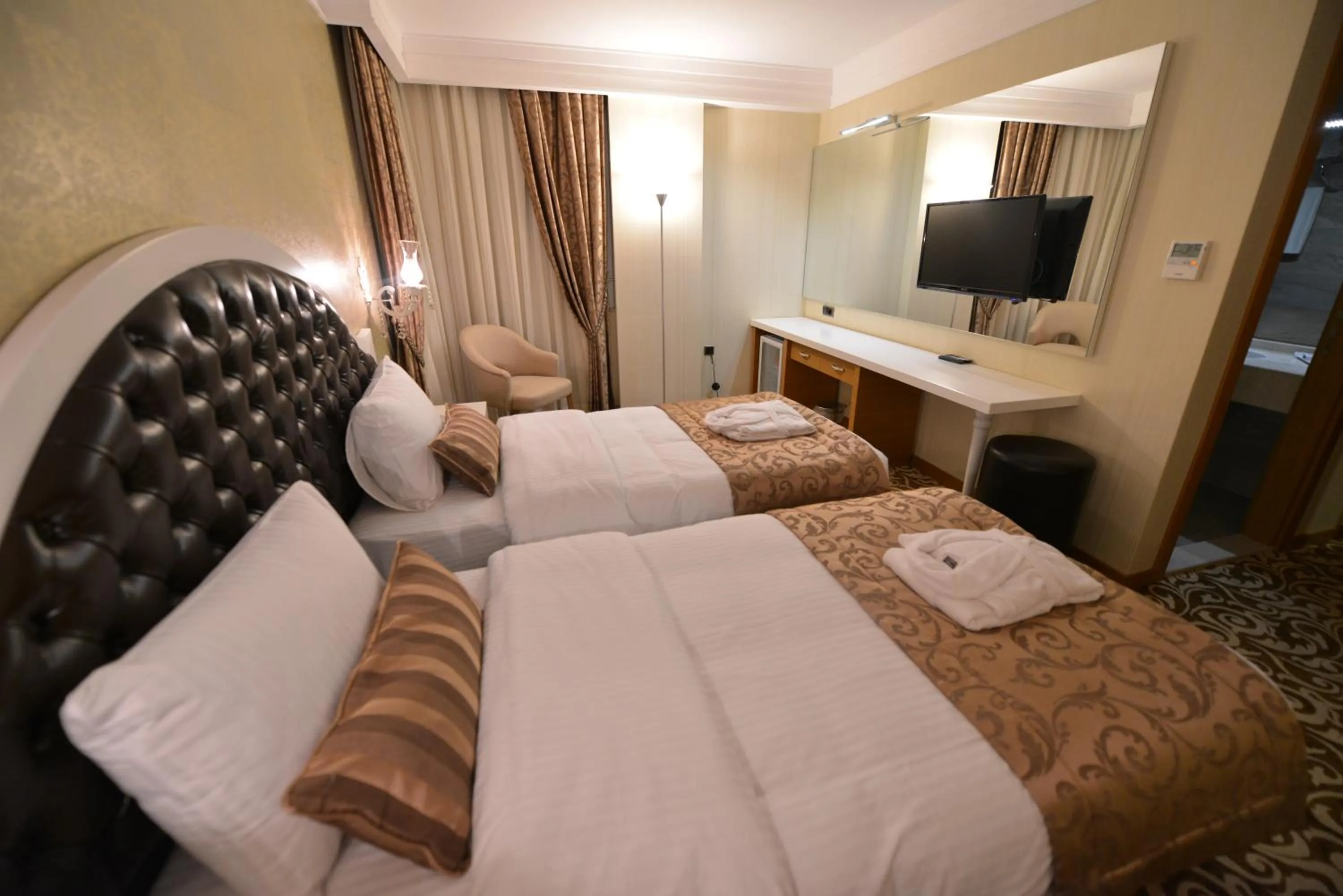Photo of the whole room, Bed in Golden Deluxe Hotel
