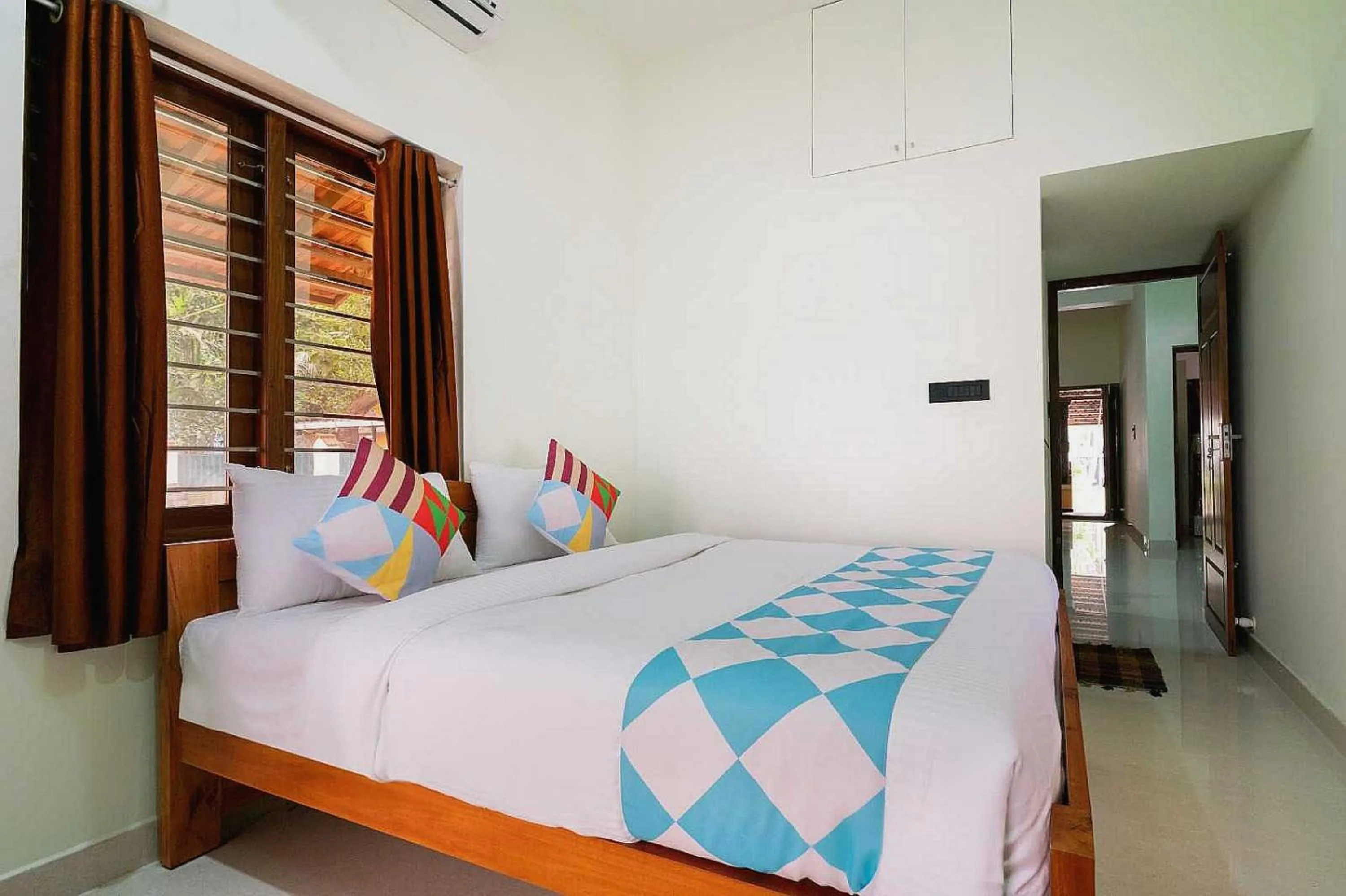 Bedroom in Hotel O ATHARVAM RESORT