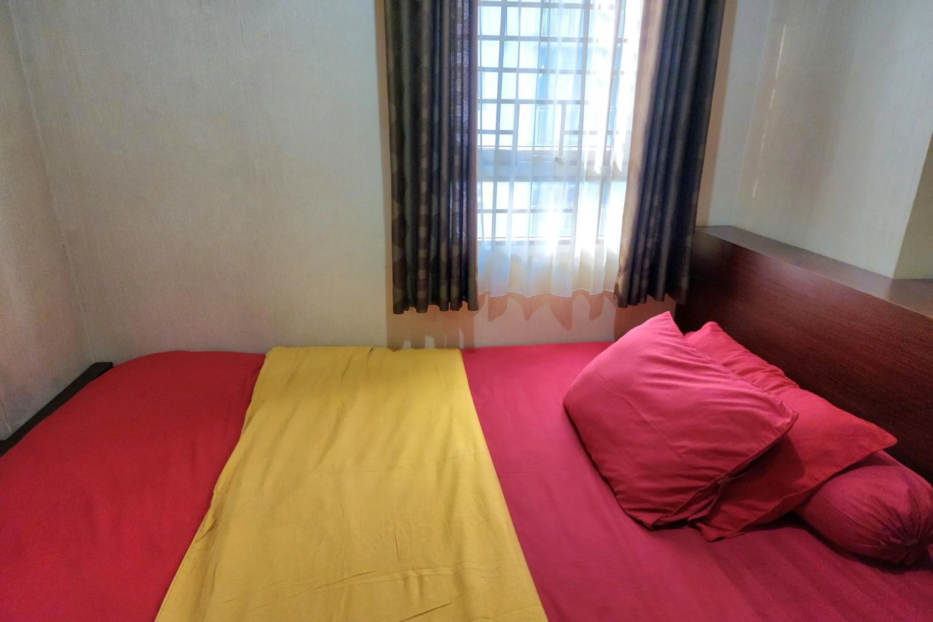 Bed in Queen Room 2 @ Grand Center Point Apartment