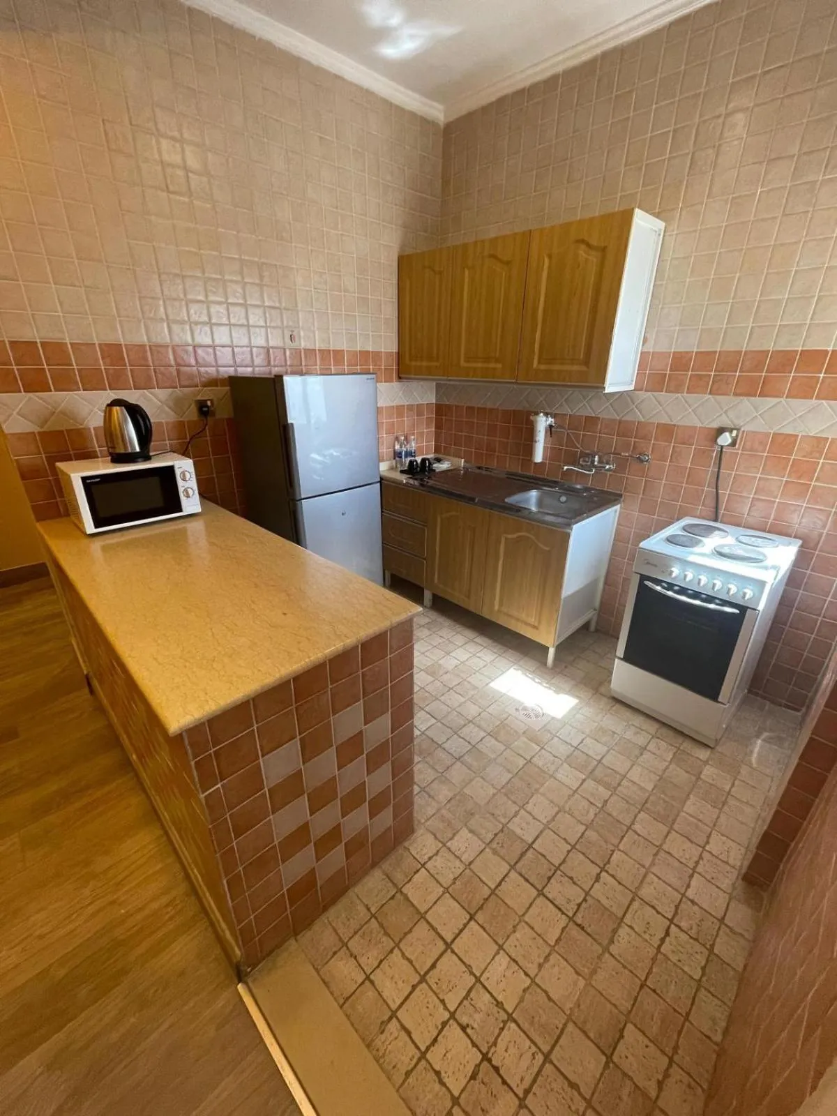 Kitchen or kitchenette in Terrace Furnished Apartments - Mahboula