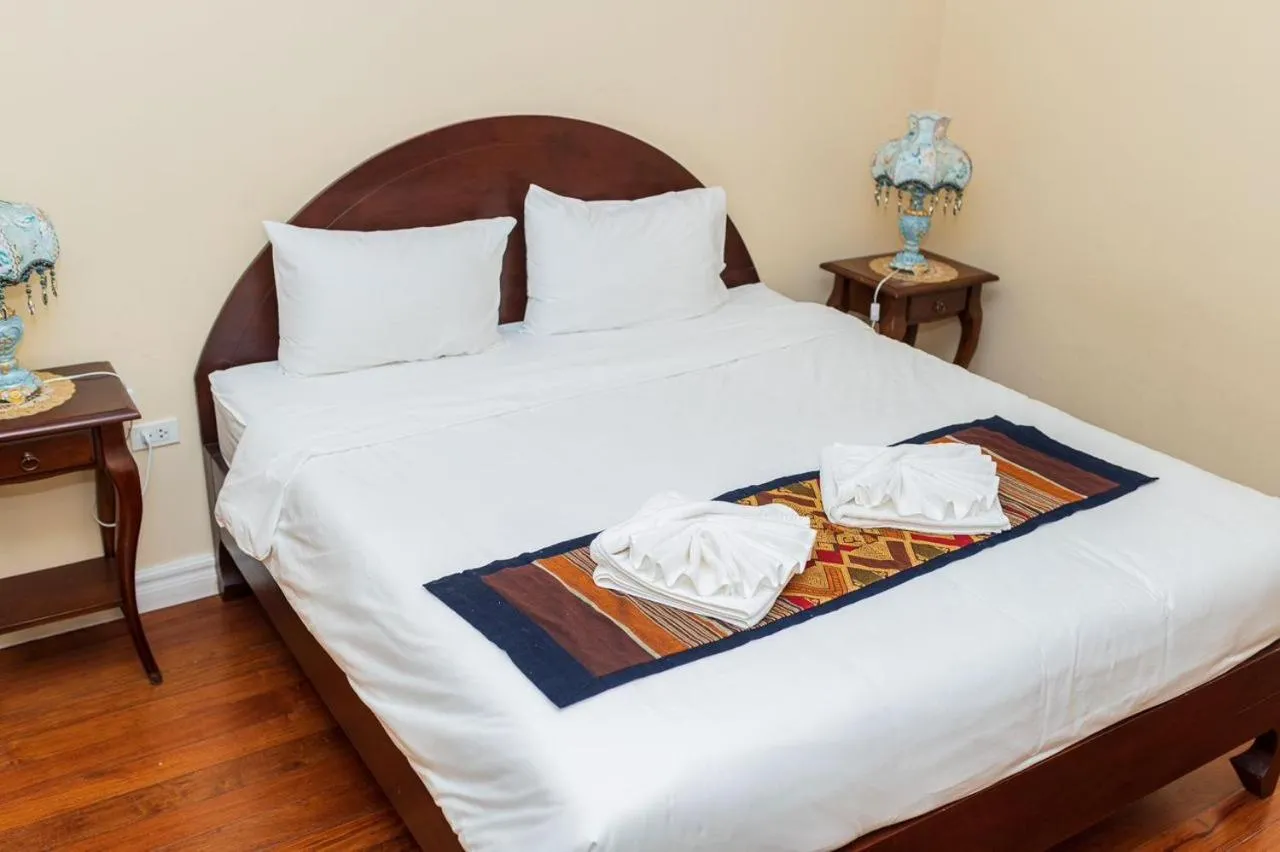 Bed in Le Luxe Boutique Hotel